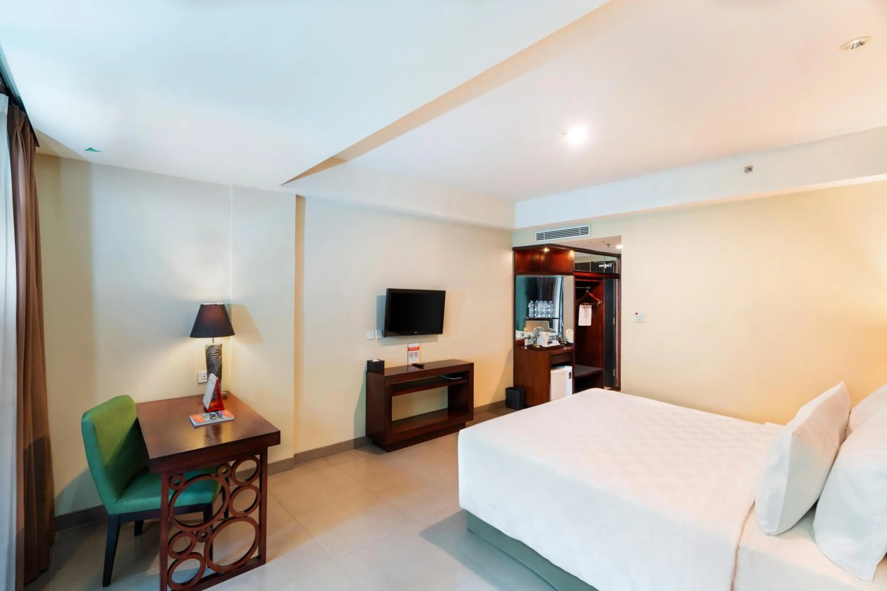 Bed in Swiss-Belhotel Rainforest