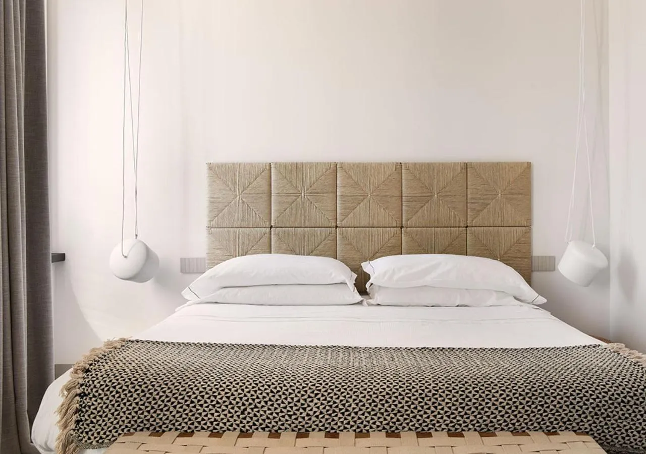 Bed in LA GUARDIA Hotel