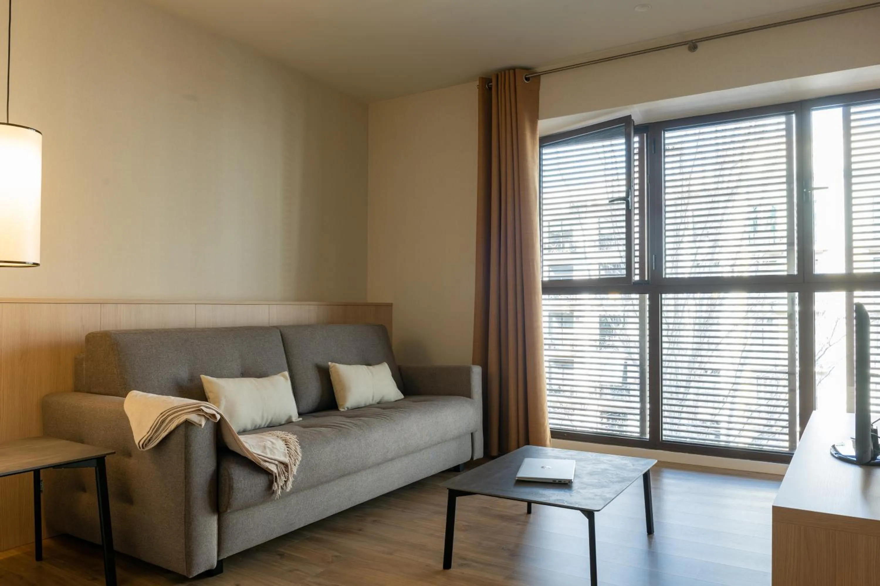 Living room in MH Apartments Urban