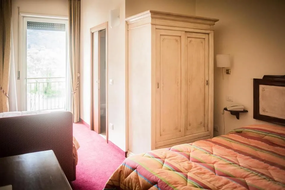 Bed in Albergo Olivo