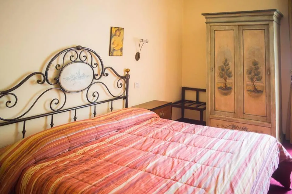 Bed in Albergo Olivo