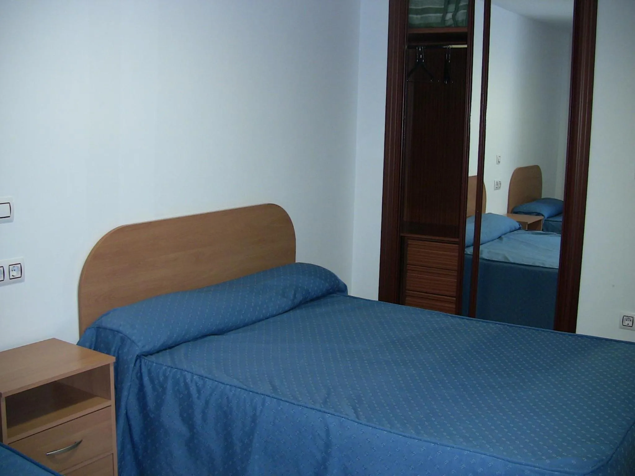 Bed in Apartahotel Los Hermanos