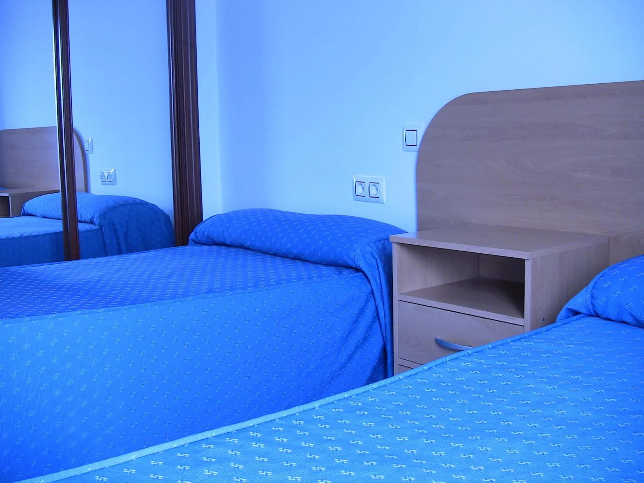 Bed in Apartahotel Los Hermanos