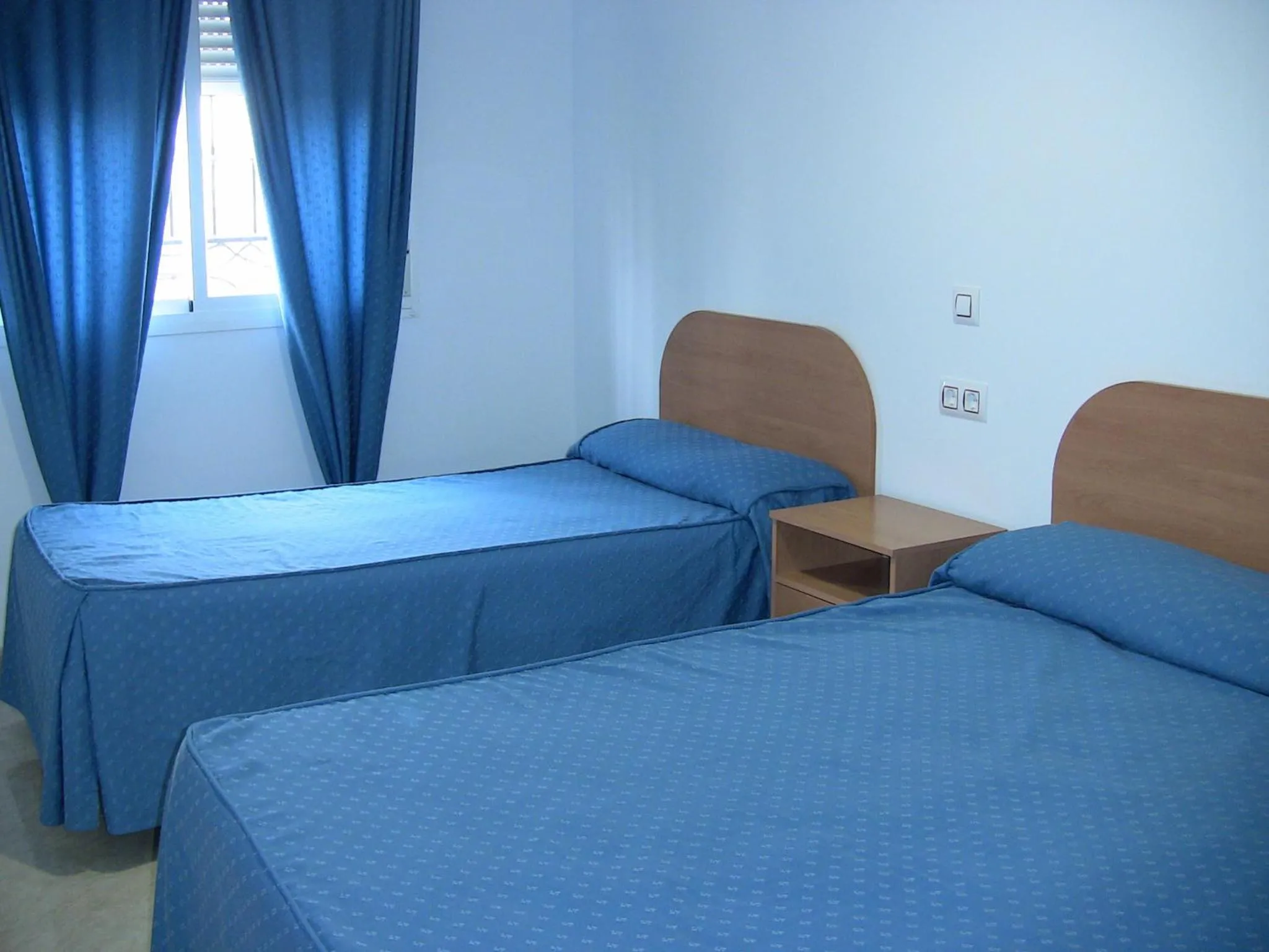 Bed in Apartahotel Los Hermanos