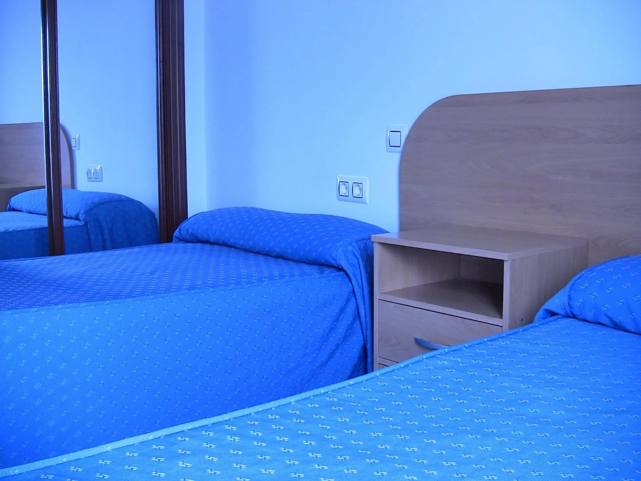 Bed in Apartahotel Los Hermanos