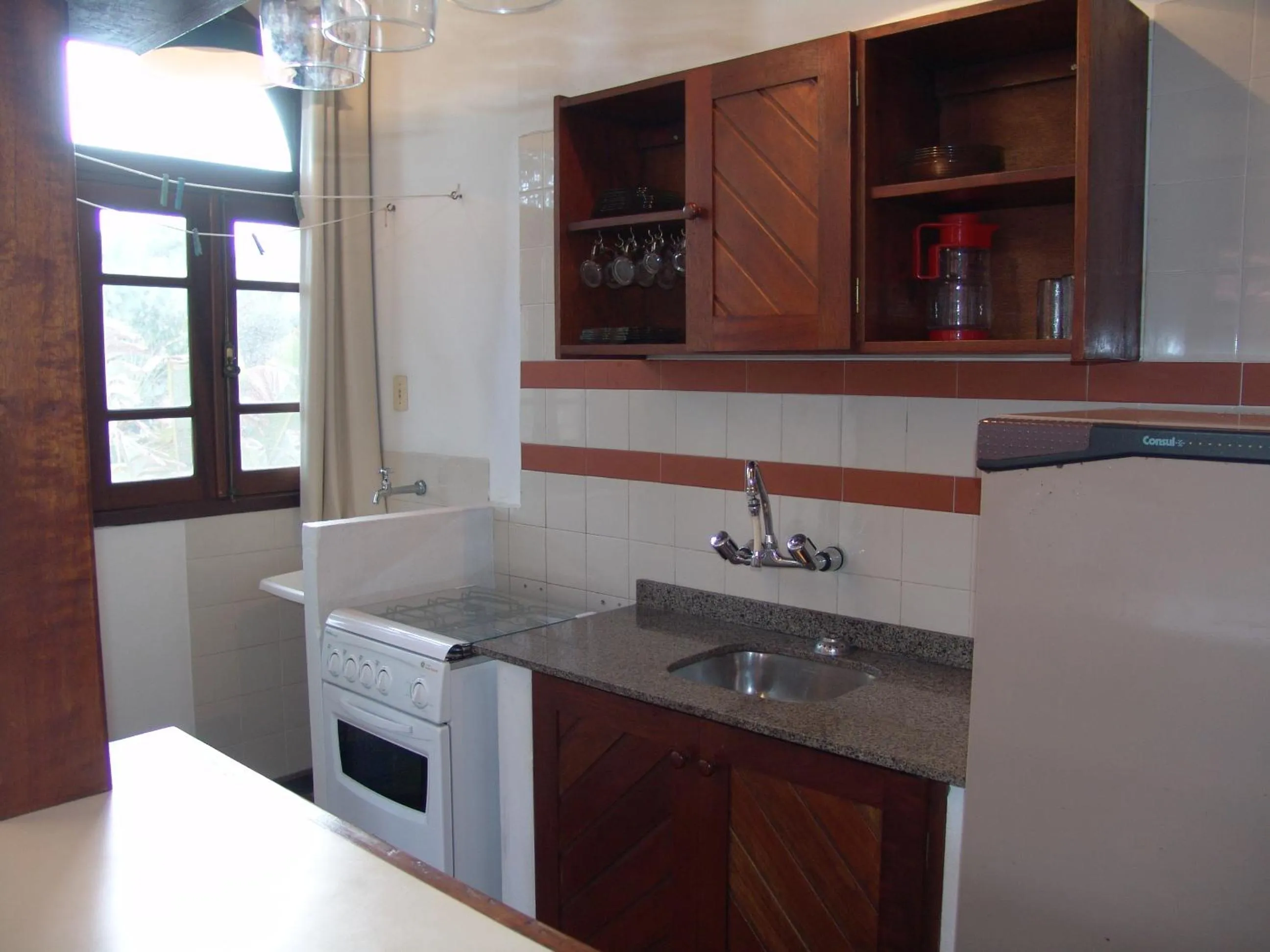 Kitchen or kitchenette in La Alhambra Apart Hotel