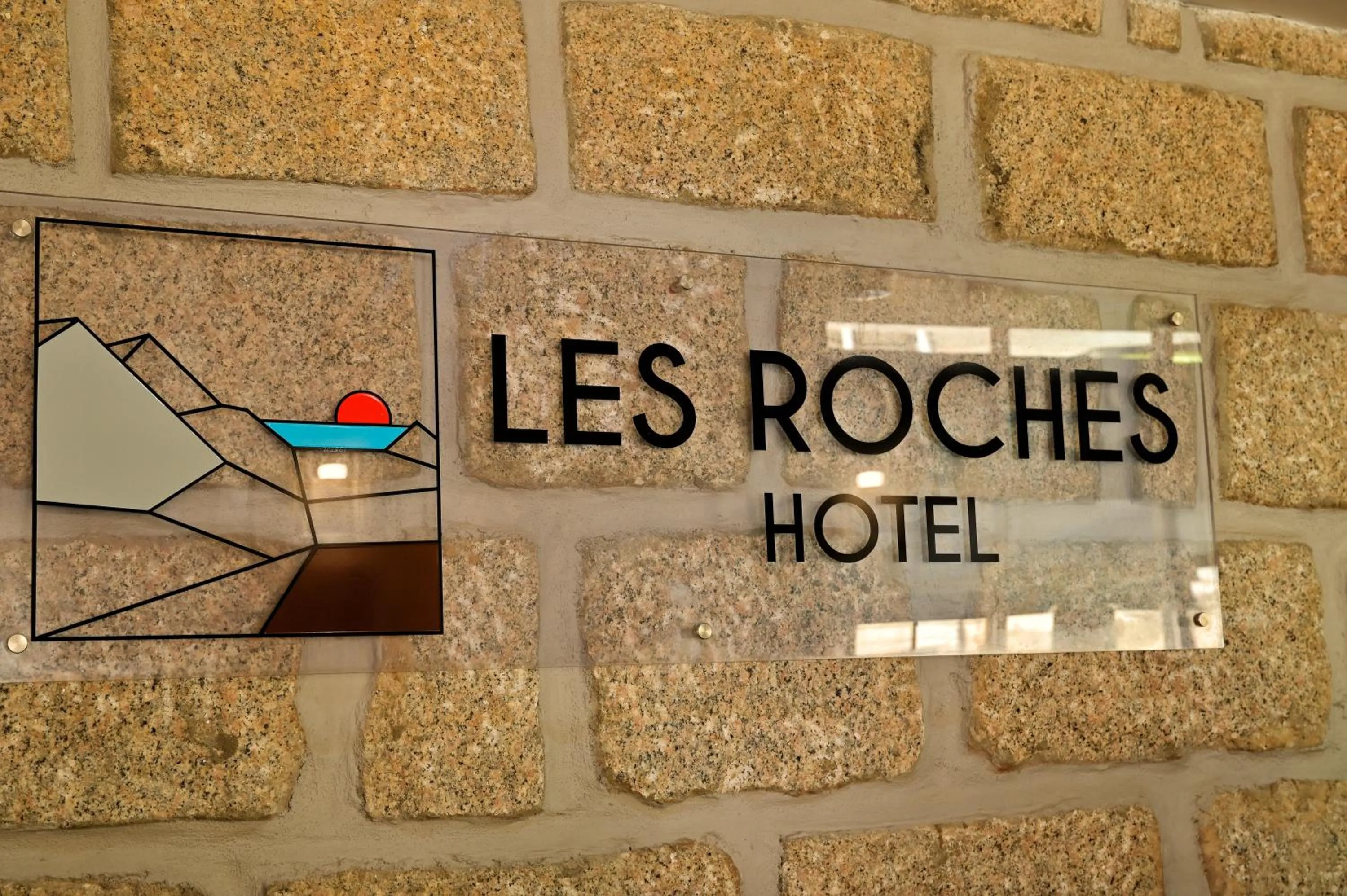 Property logo or sign in Hotel Des Roches