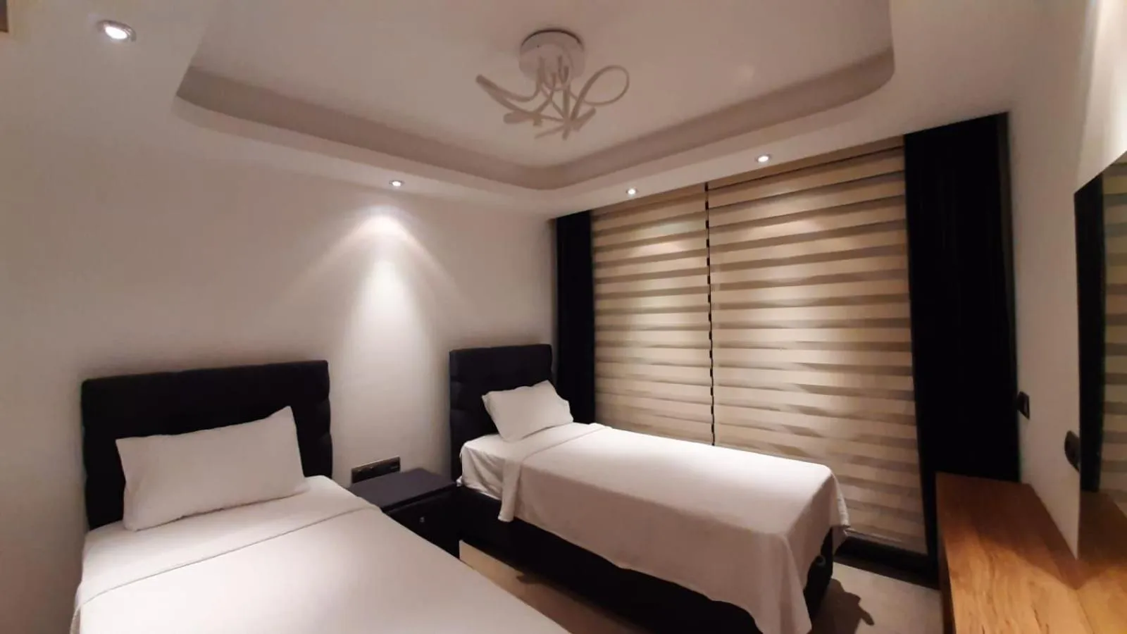 Bed in Elite Luxury Suite & Spa