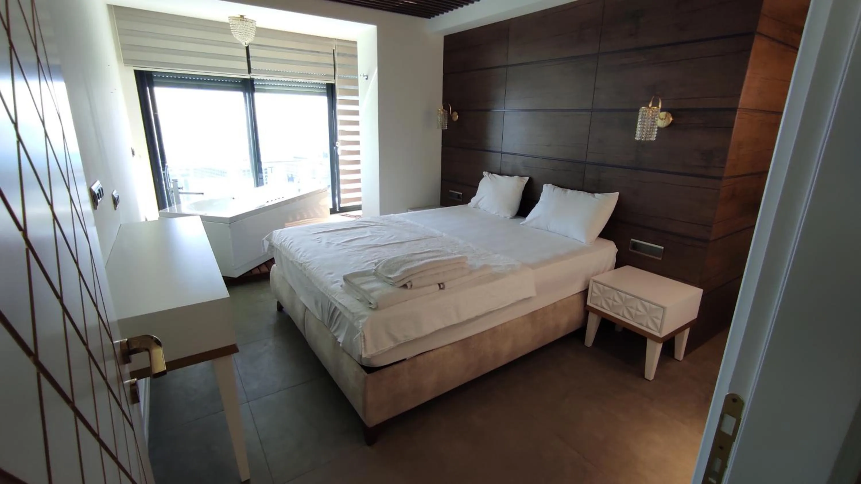 Bed in Elite Luxury Suite & Spa