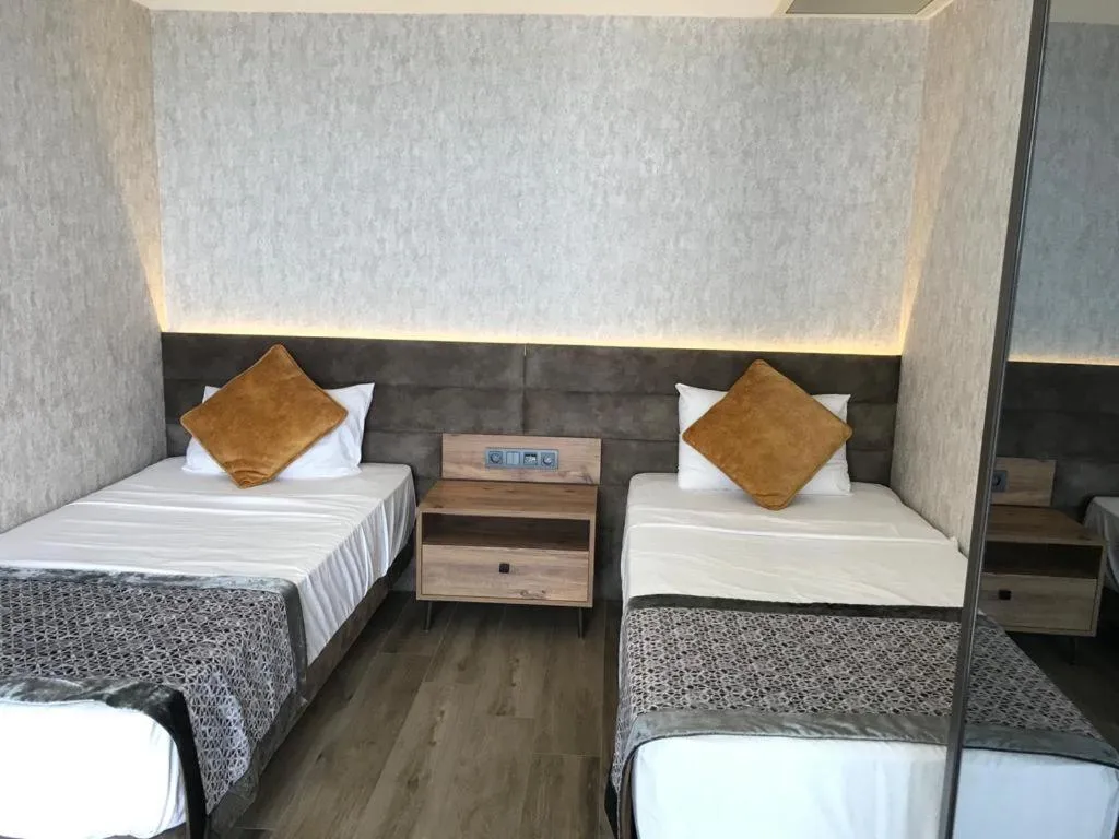 Bed in Elite Luxury Suite & Spa
