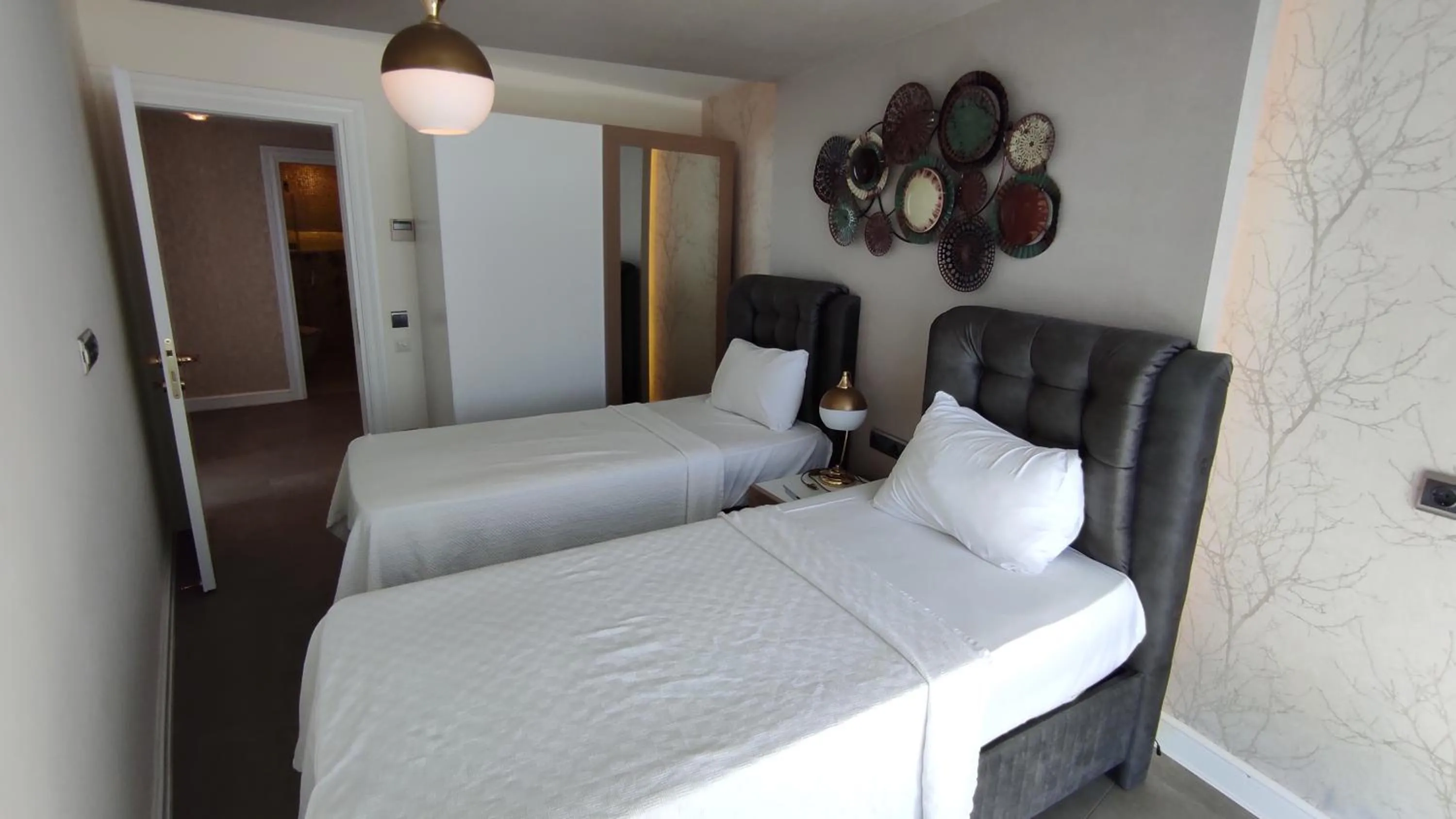 Bed in Elite Luxury Suite & Spa