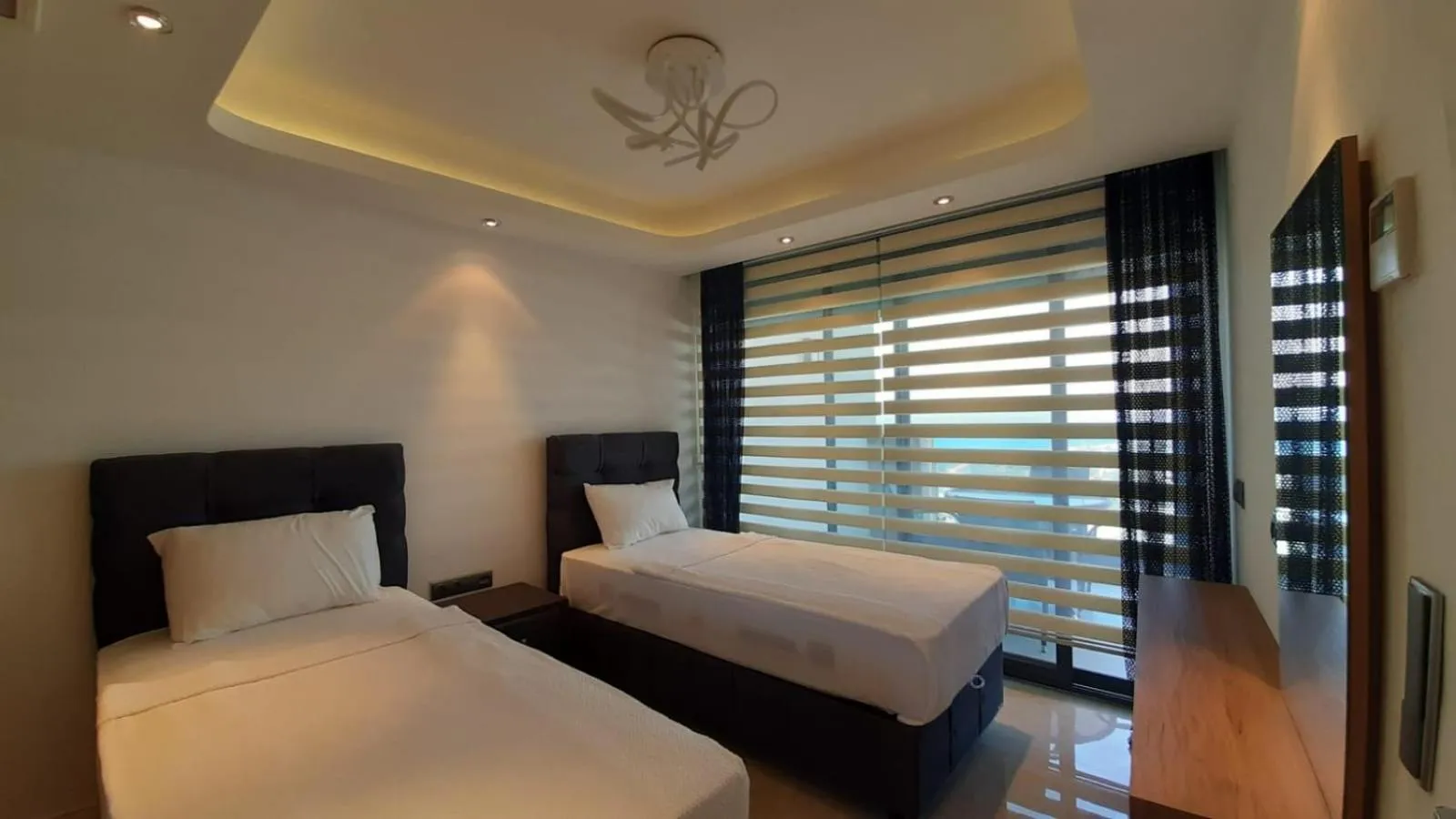 Bed in Elite Luxury Suite & Spa