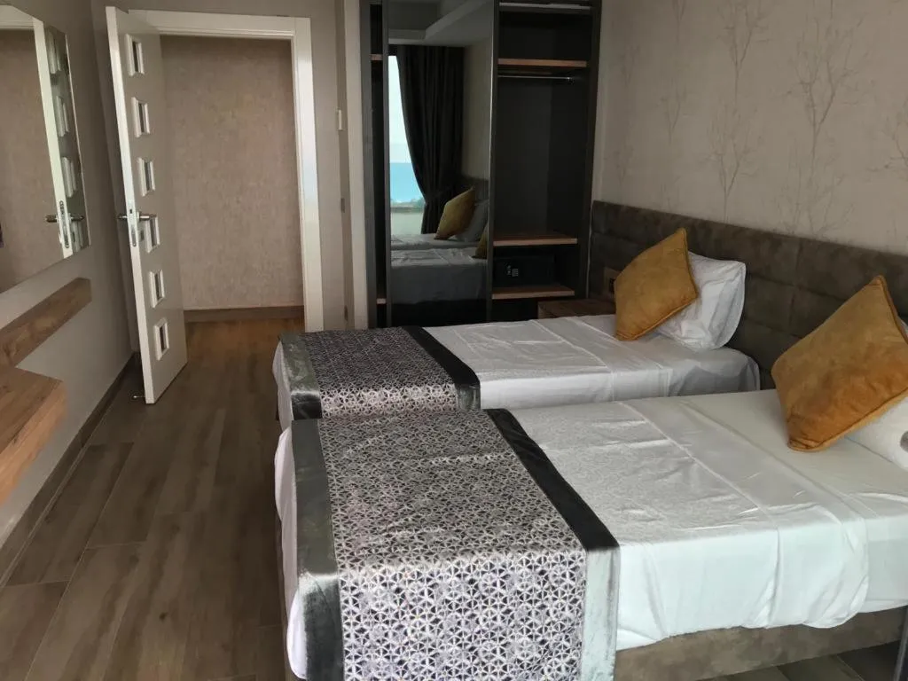 Bed in Elite Luxury Suite & Spa