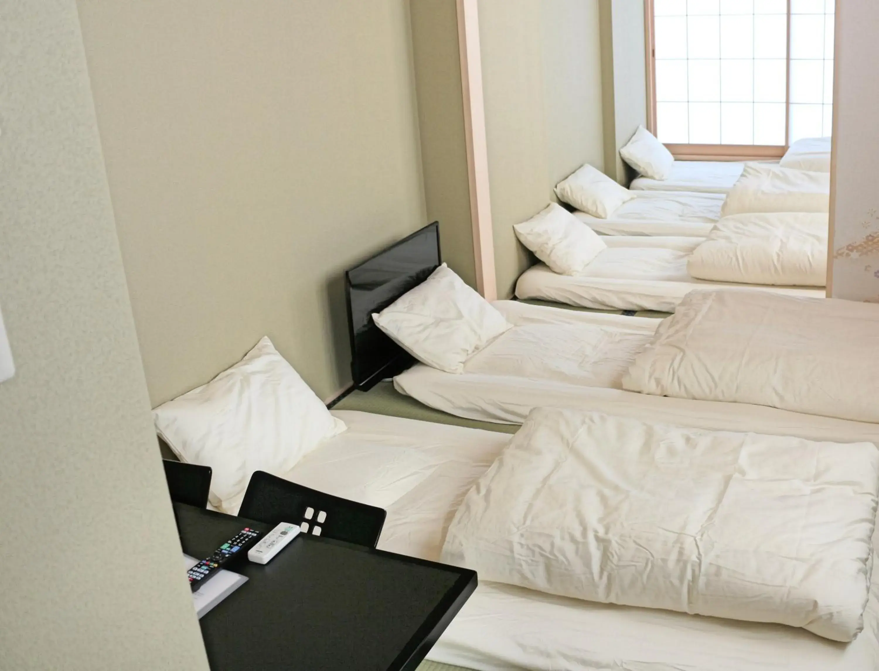 Bed in Akihabara Nakagawa Inn Bed in Akihabara Nakagawa Inn