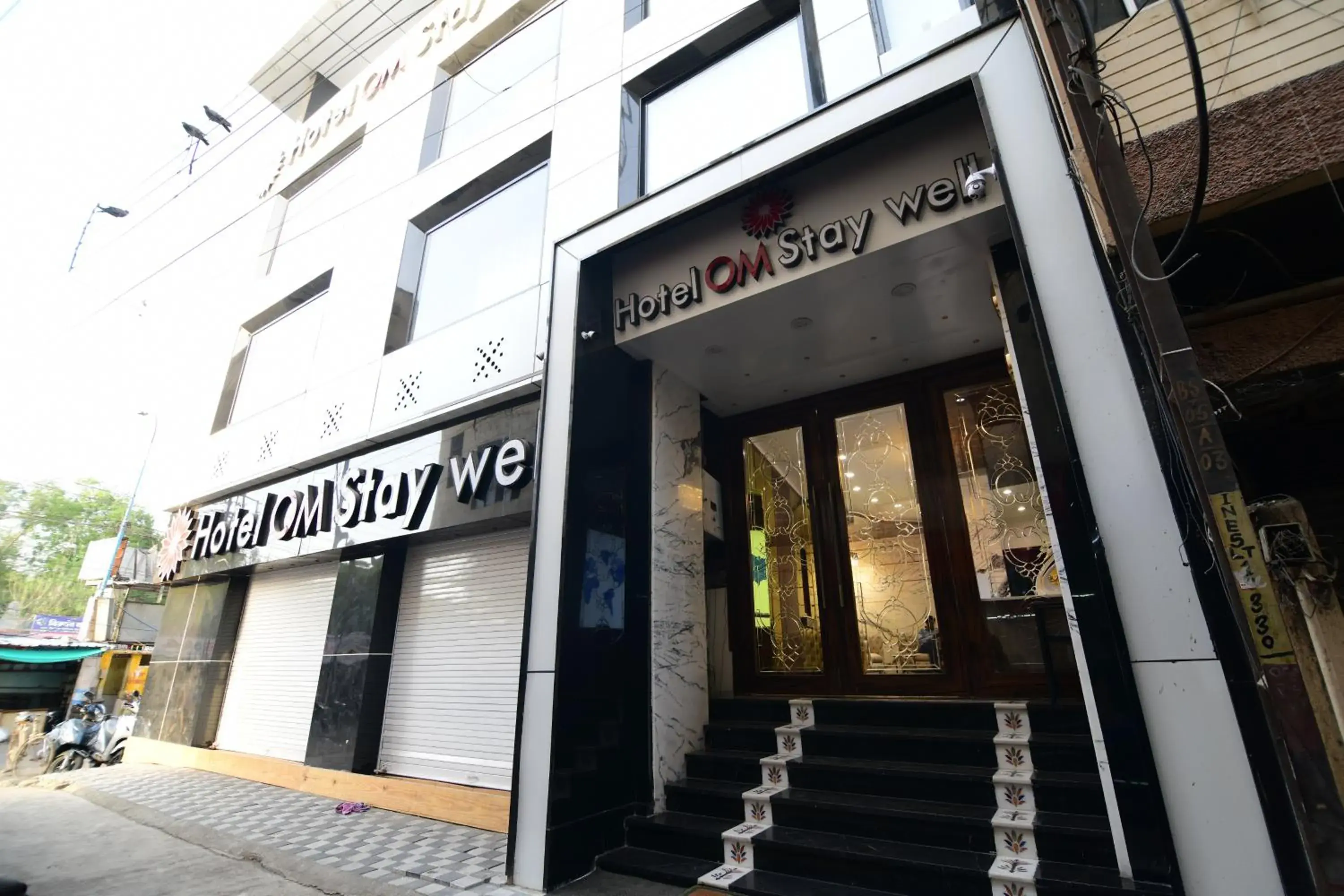 Property building in Hotel Om Stay Well Property building in Hotel Om Stay Well