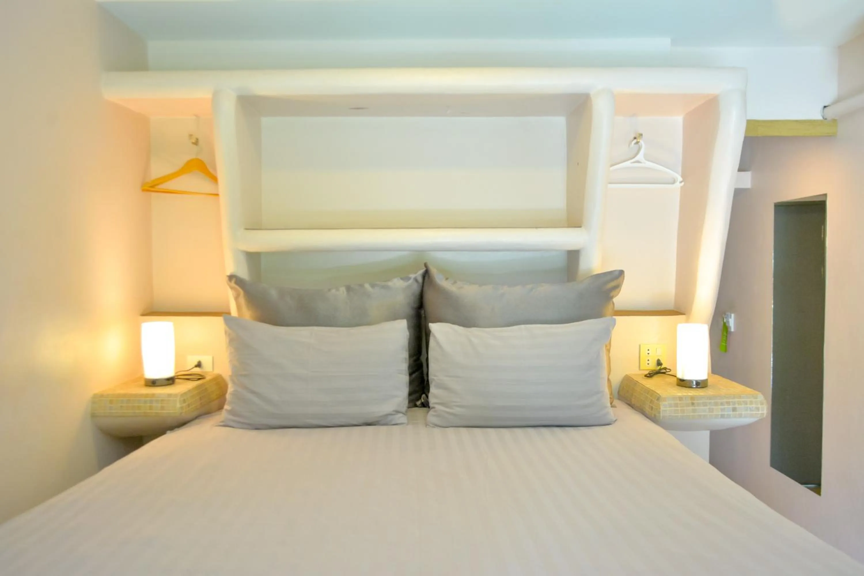 Bed in Le Divine Comedie Beach Resort
