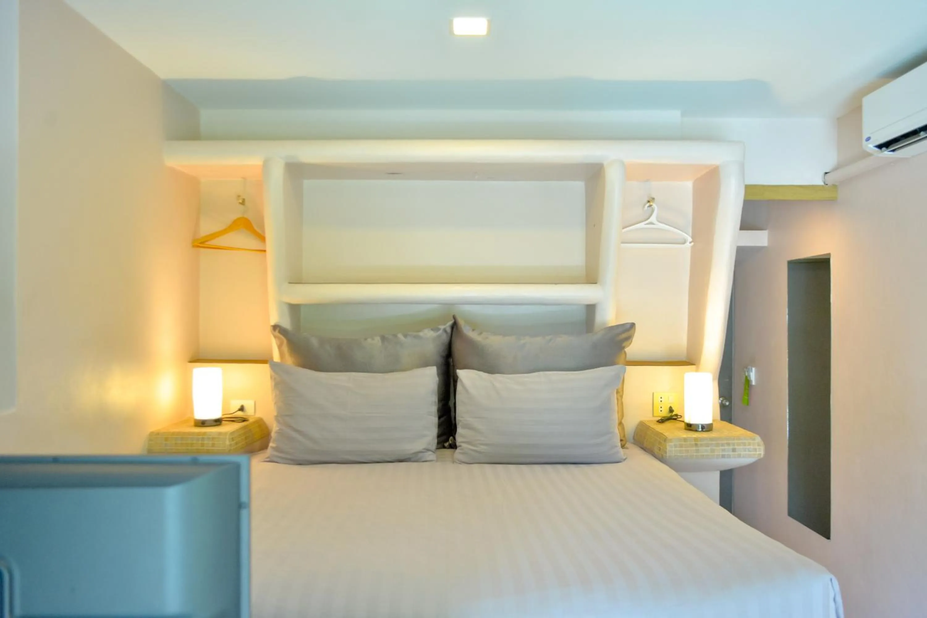 Bed in Le Divine Comedie Beach Resort