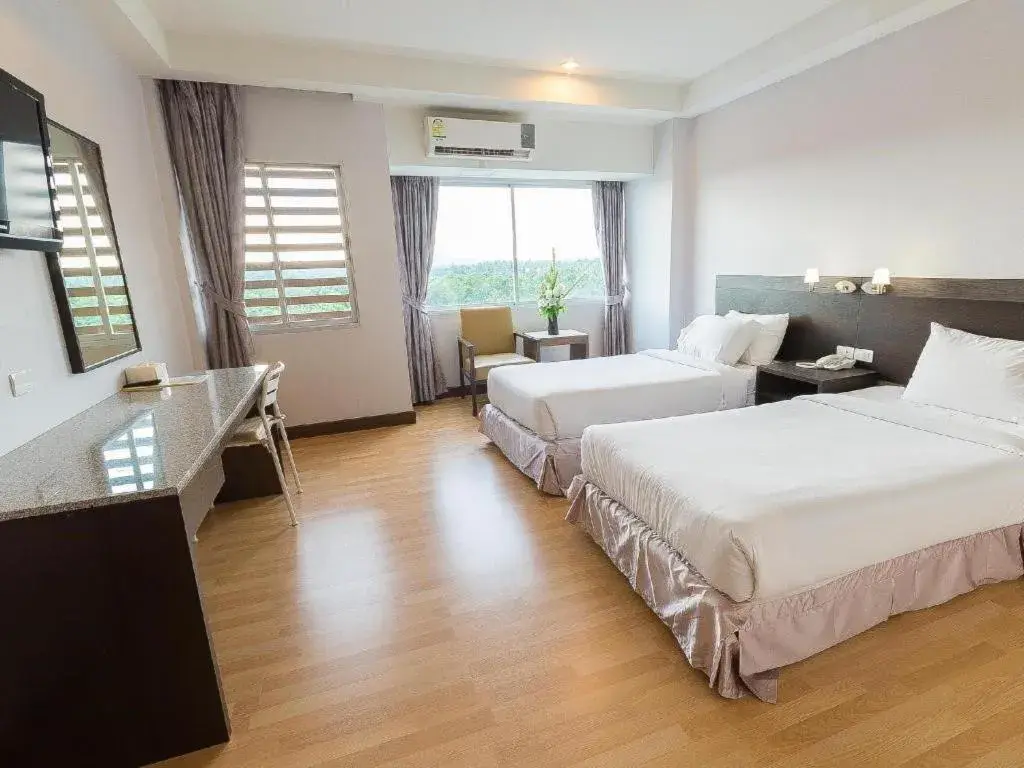 Bed in SinKiat Buri Hotel Bed in SinKiat Buri Hotel