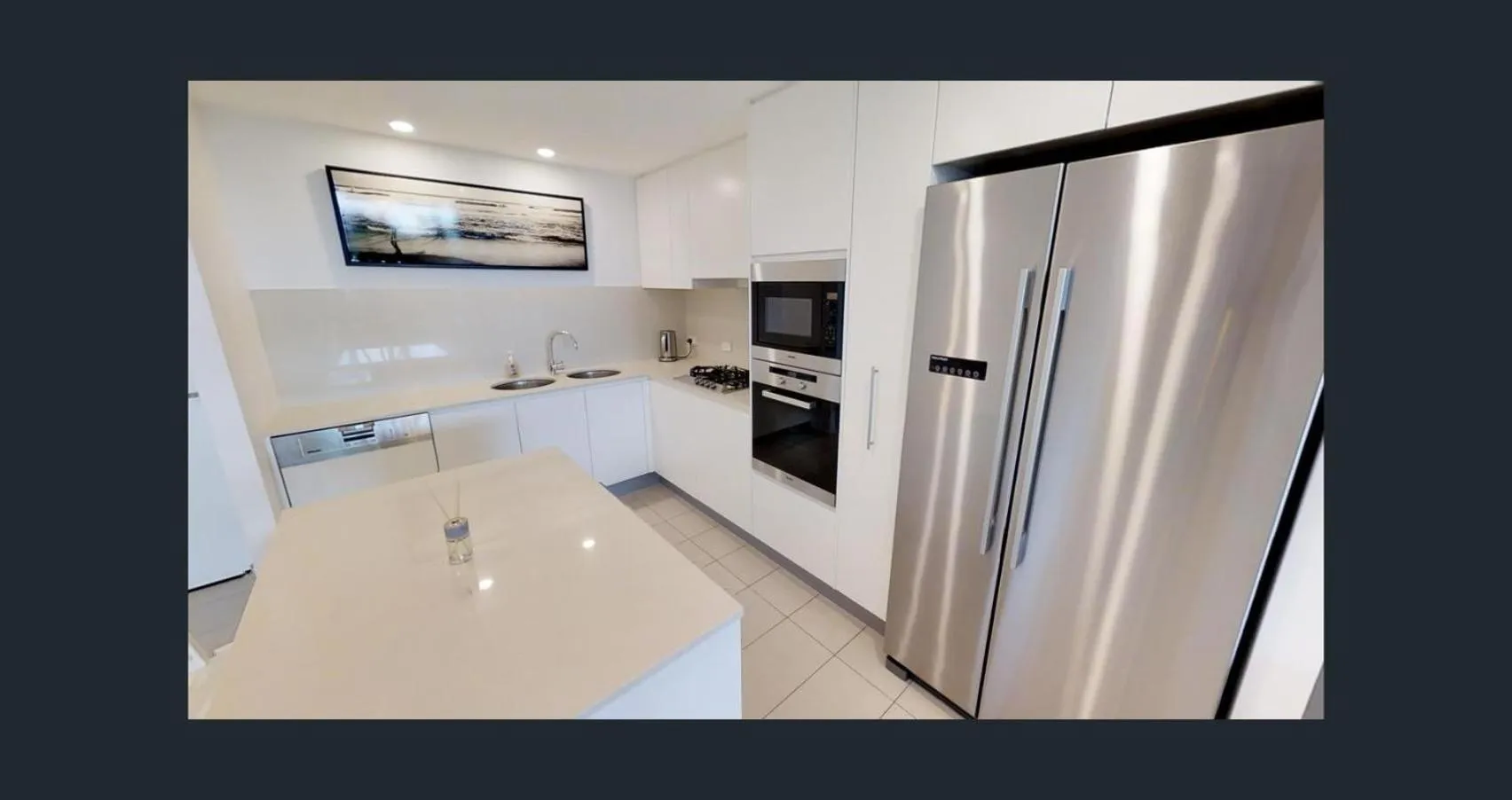 Kitchen or kitchenette in Kirra Surf Apartments