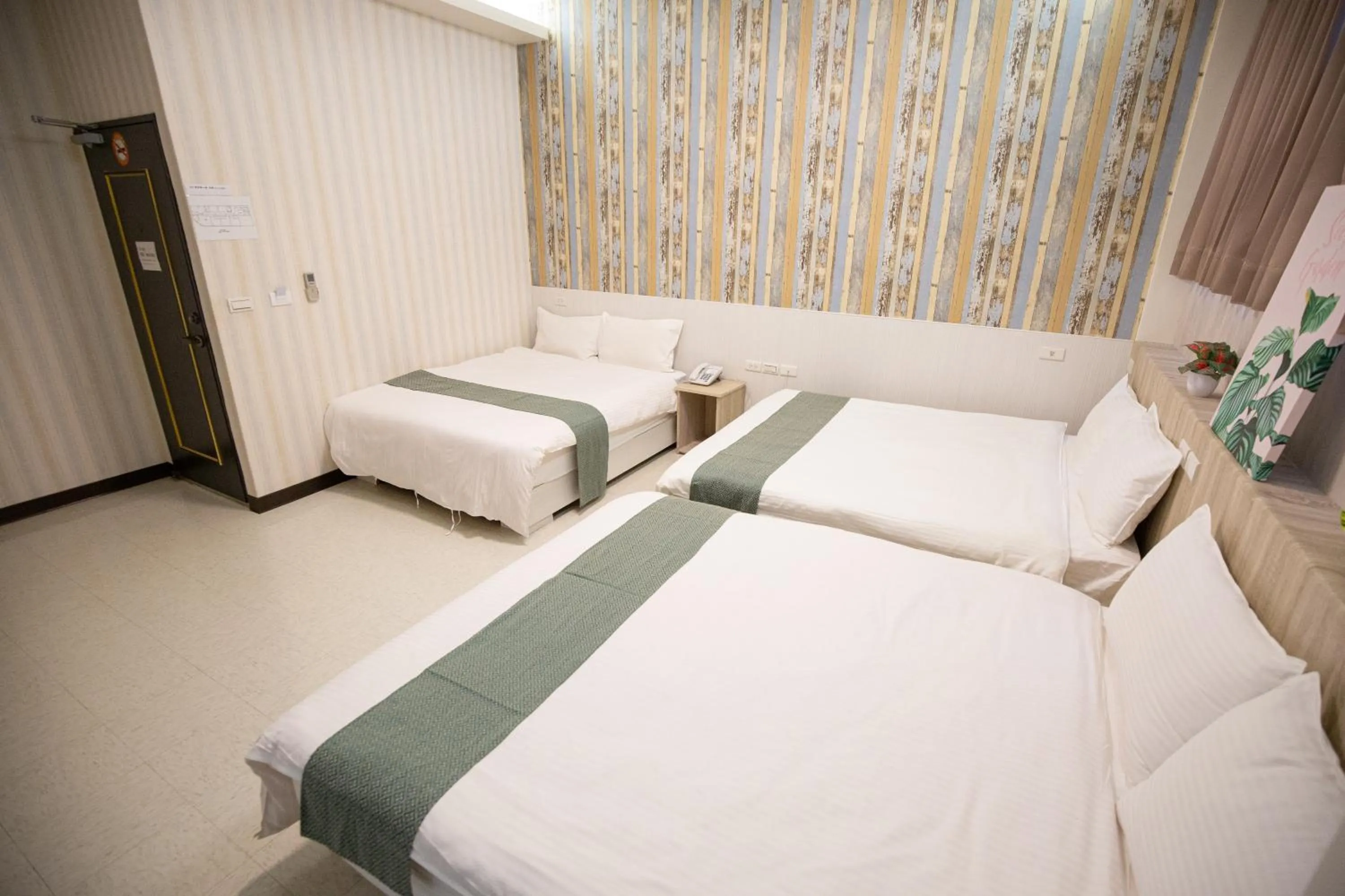 Bed in Jia-Jia Business Hotel