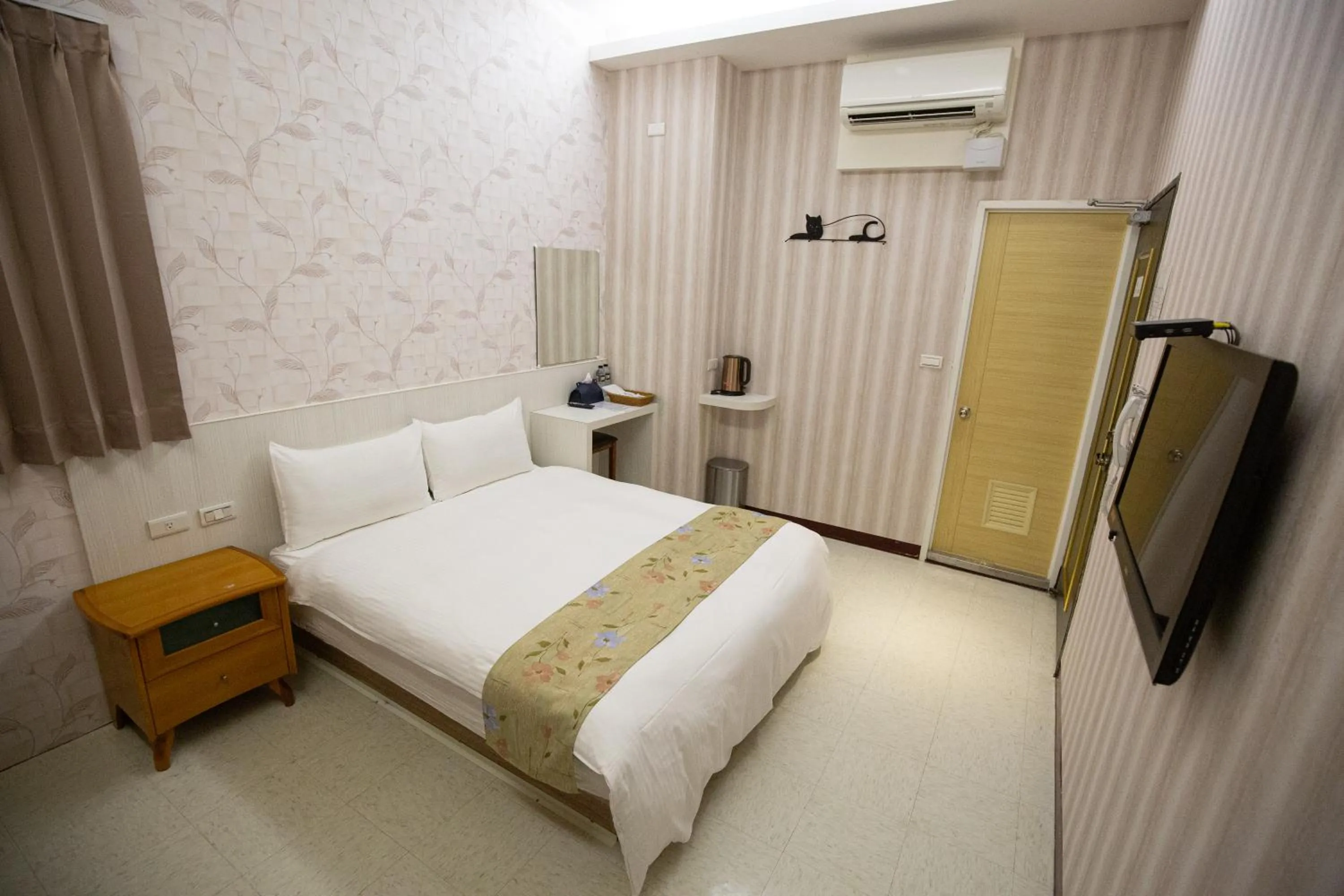 Bed in Jia-Jia Business Hotel