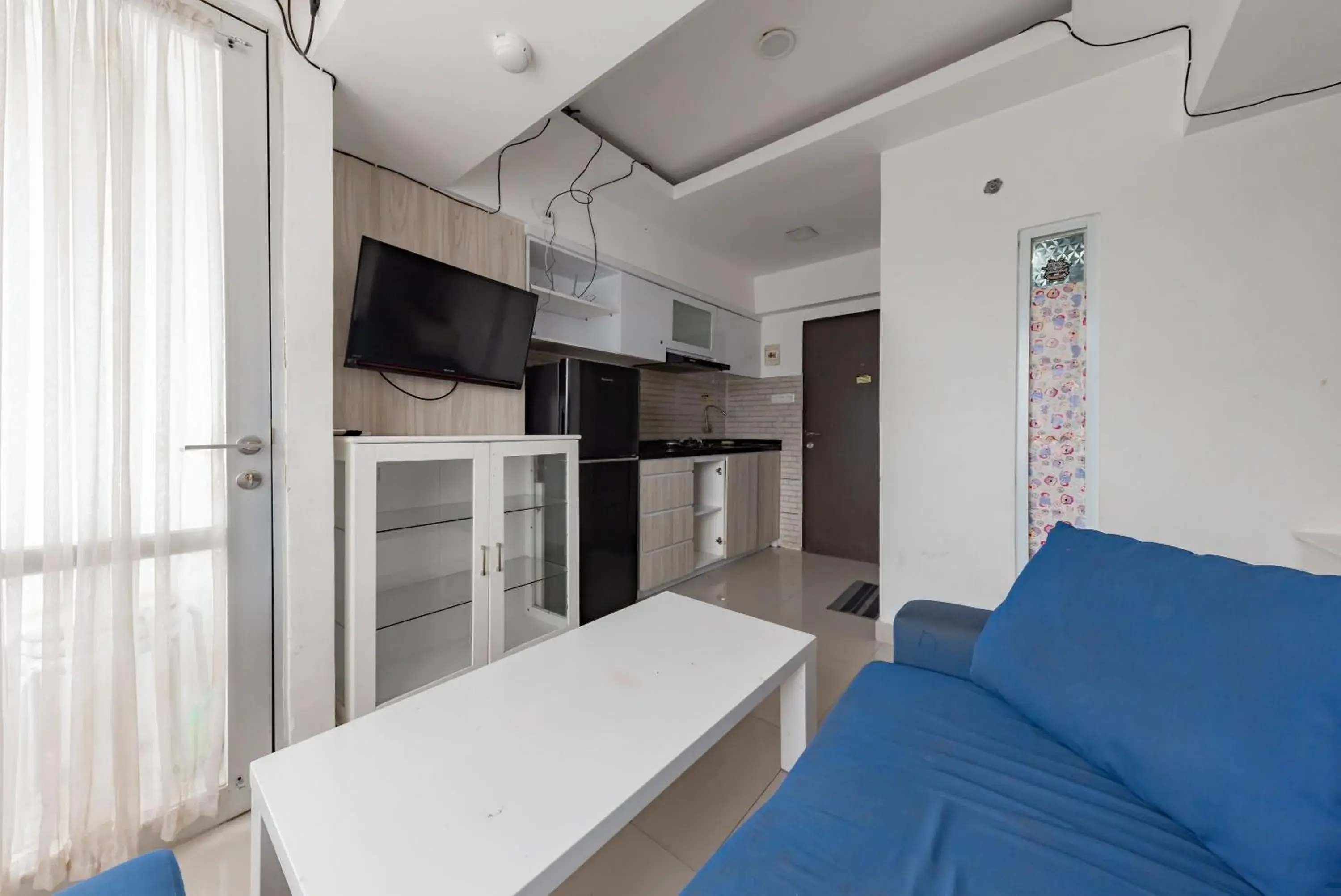 Living room in RedDoorz Apartment @ Jarrdin Cihampelas Living room in RedDoorz Apartment @ Jarrdin Cihampelas