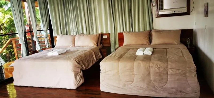 Bed in Descanso En Paraiso Resort