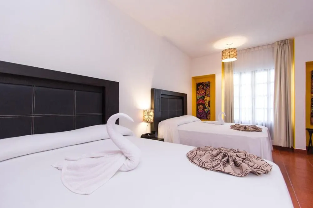 Bed in Hotel Santa Cruz Huatulco