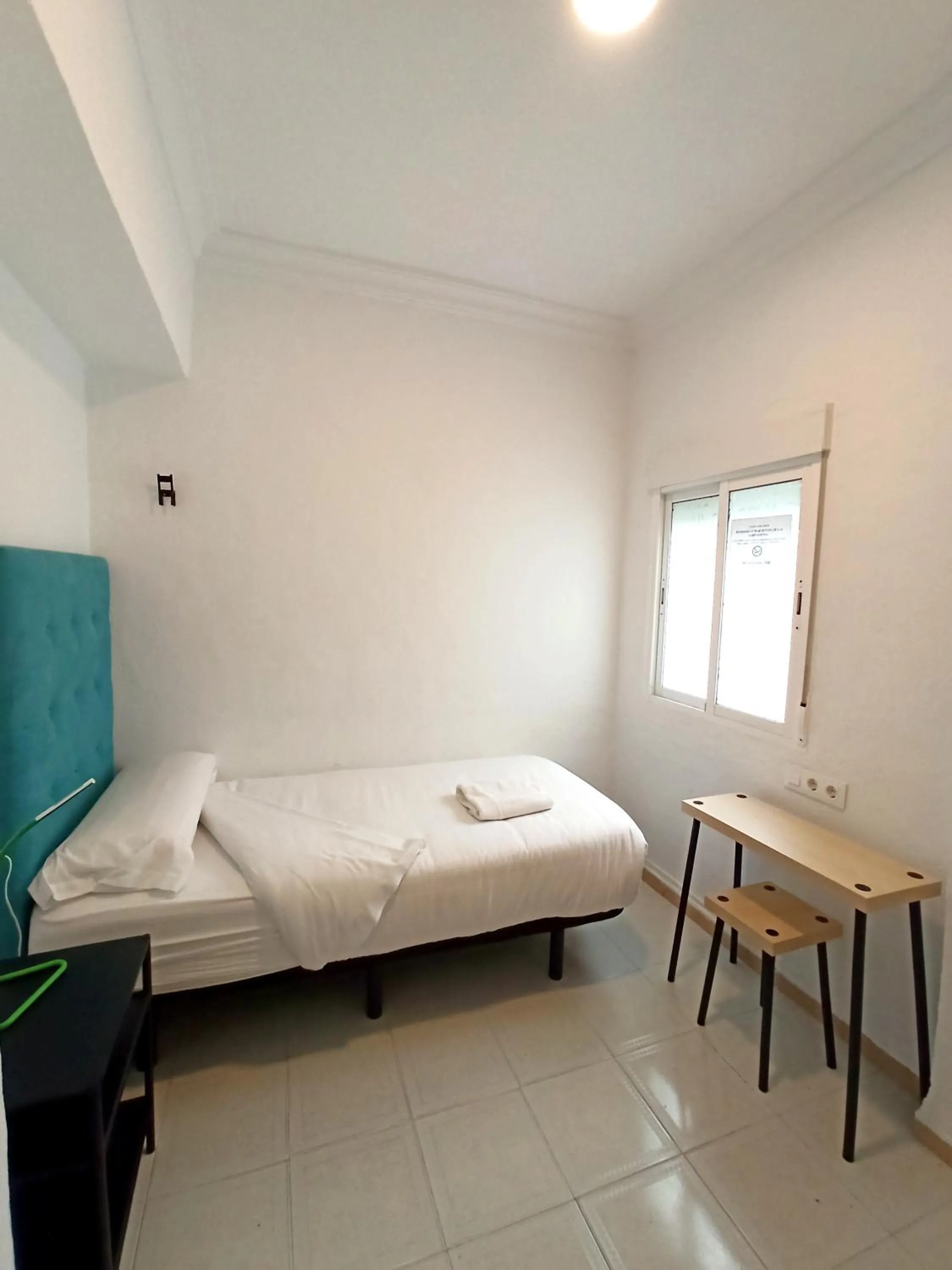 Bed in Vivian's Guest House Auto Check-in