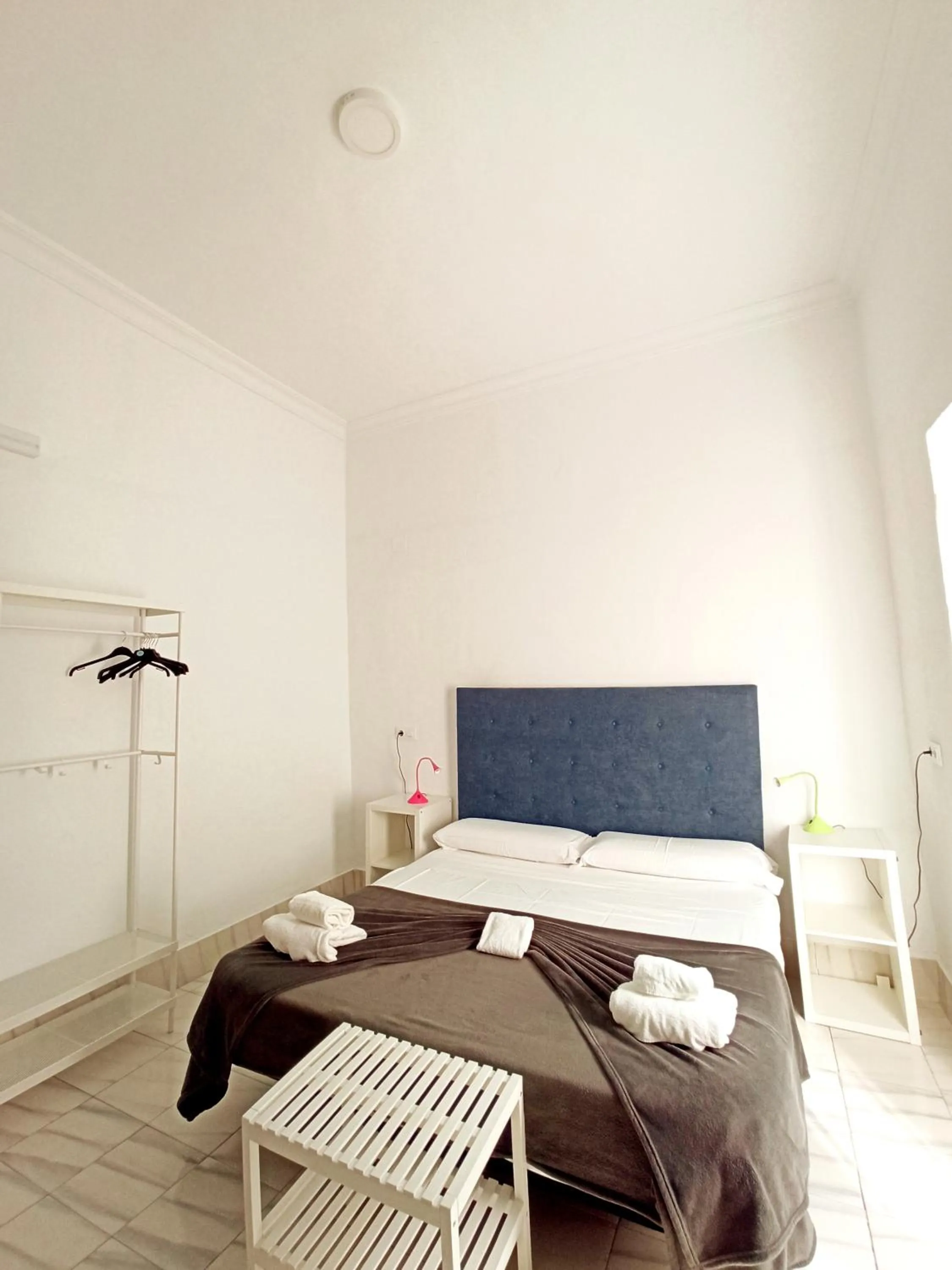 Bed in Vivian's Guest House Auto Check-in