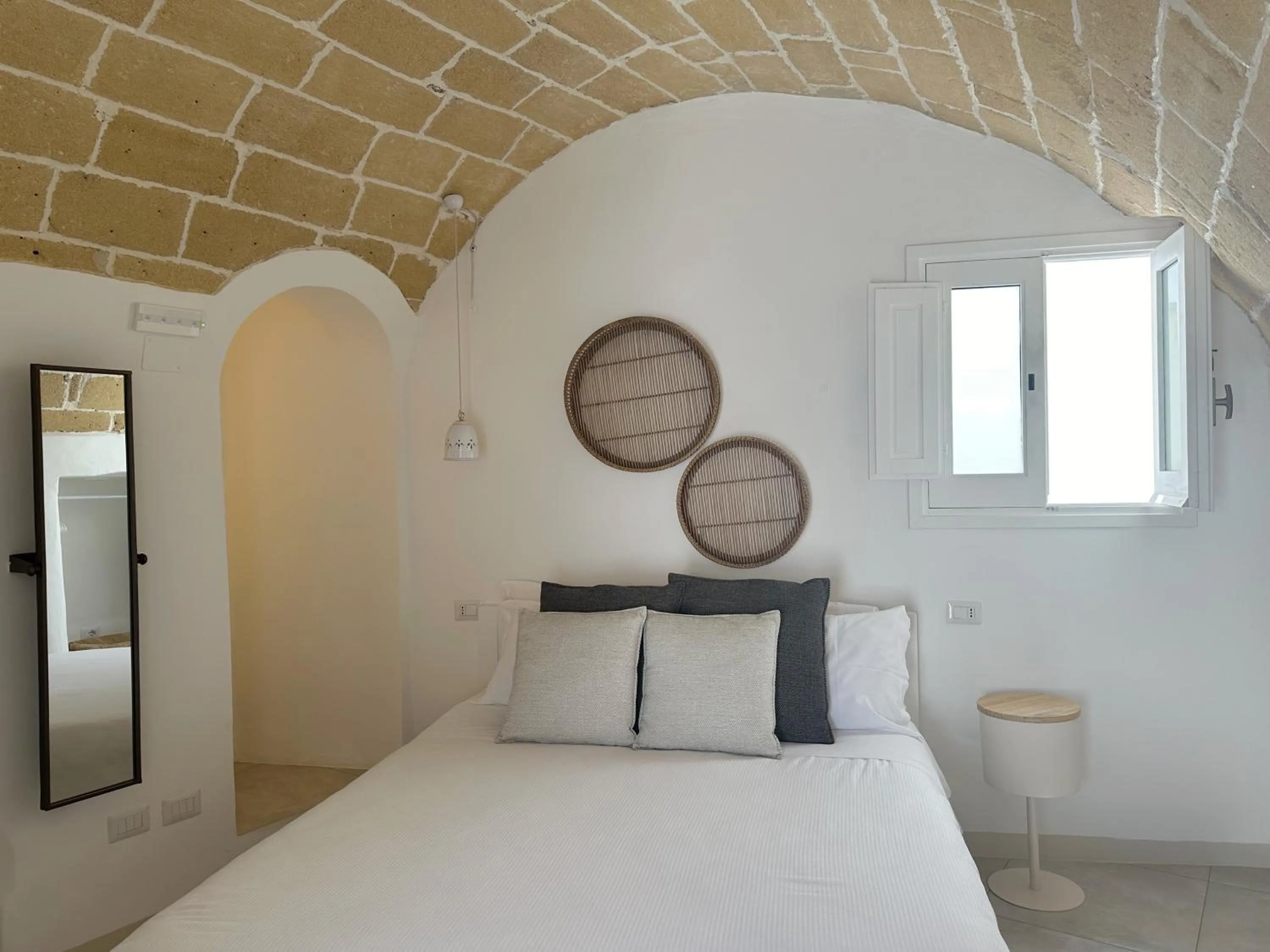 Bed in Palmieri Luxury Rooms