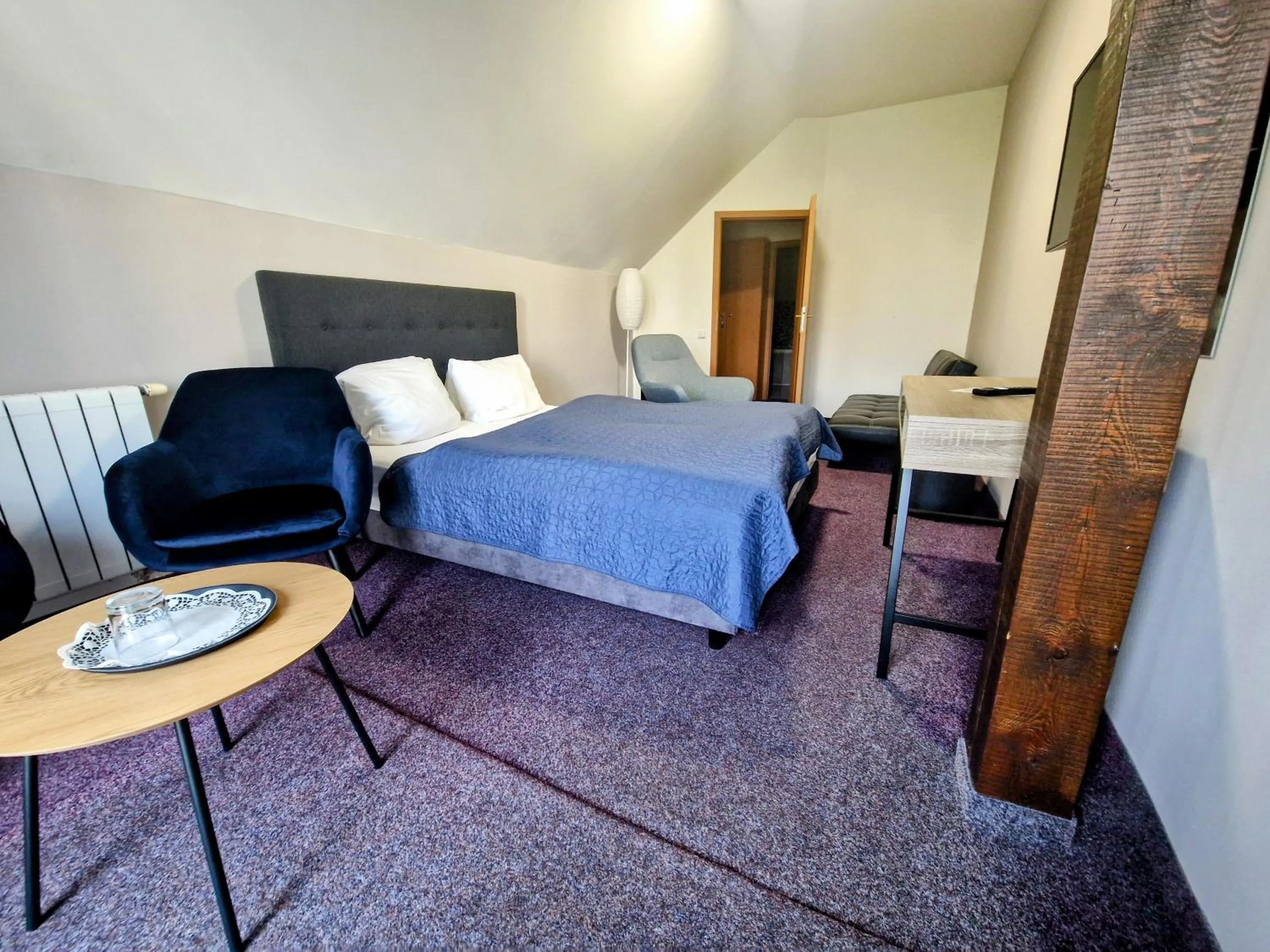 Bed in Family hotel Maxim