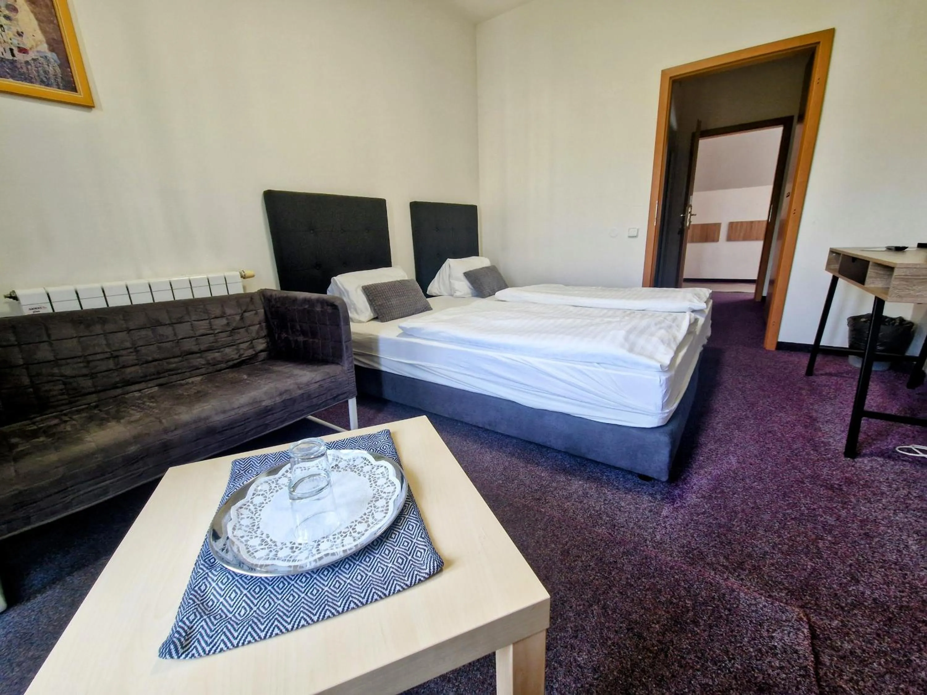 Bed in Family hotel Maxim