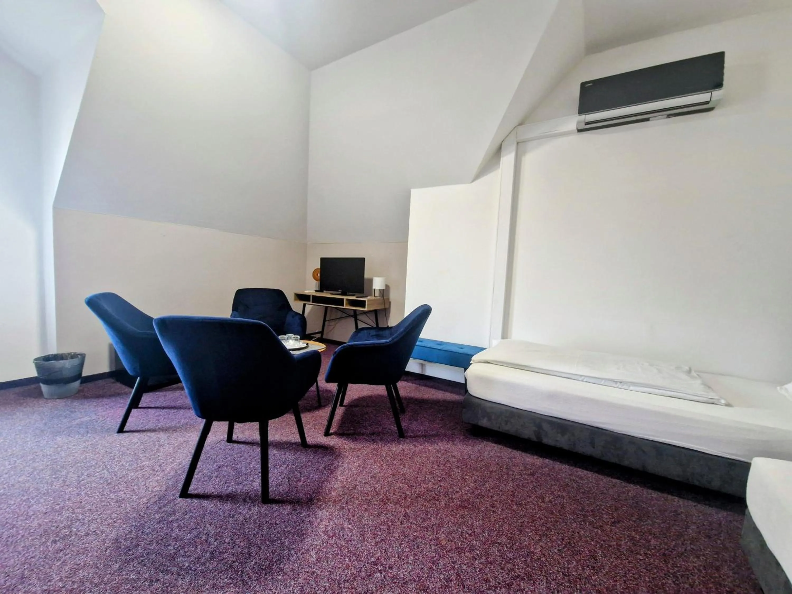 Bed in Family hotel Maxim