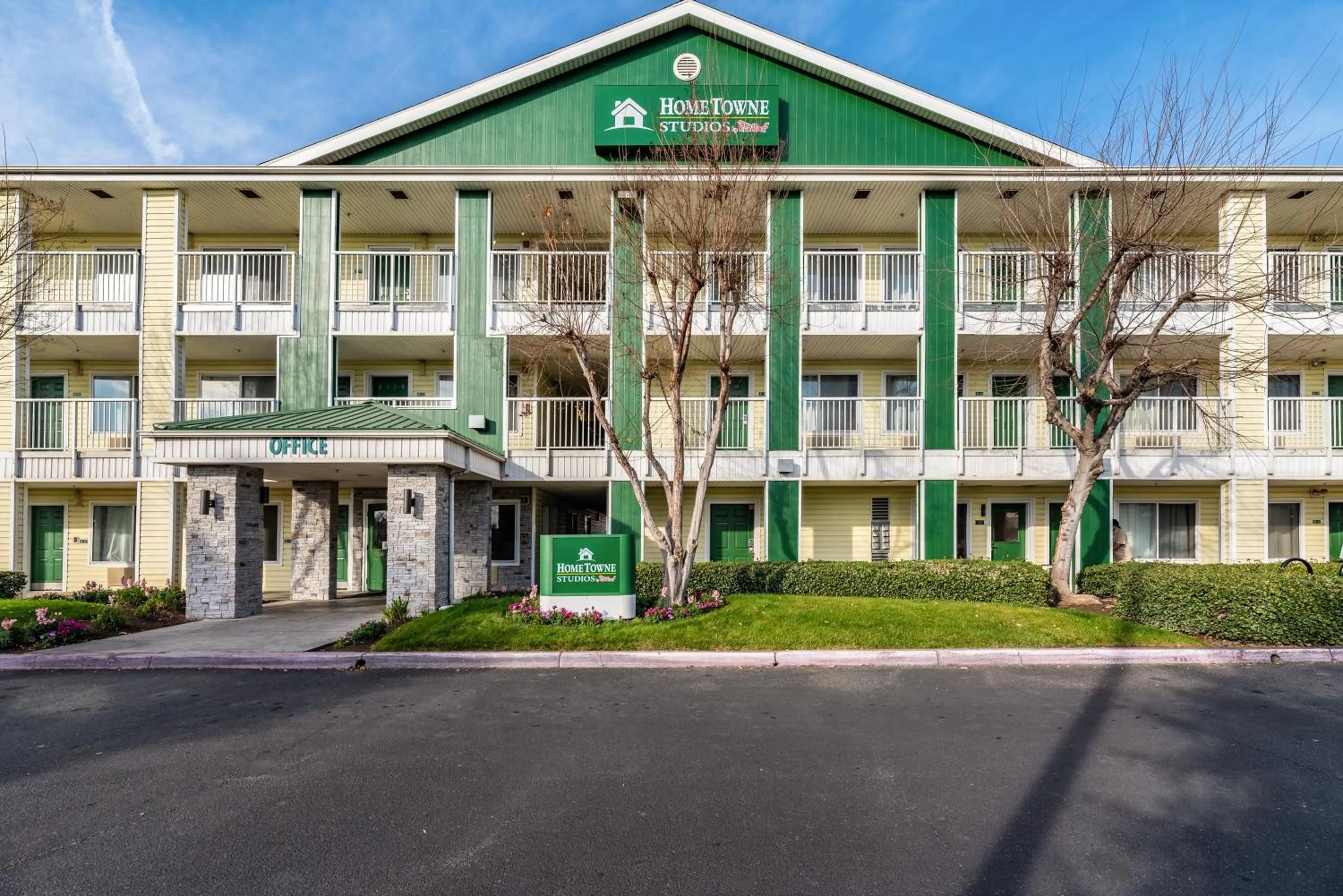 Property building in HomeTowne Studios by Red Roof Fresno - West