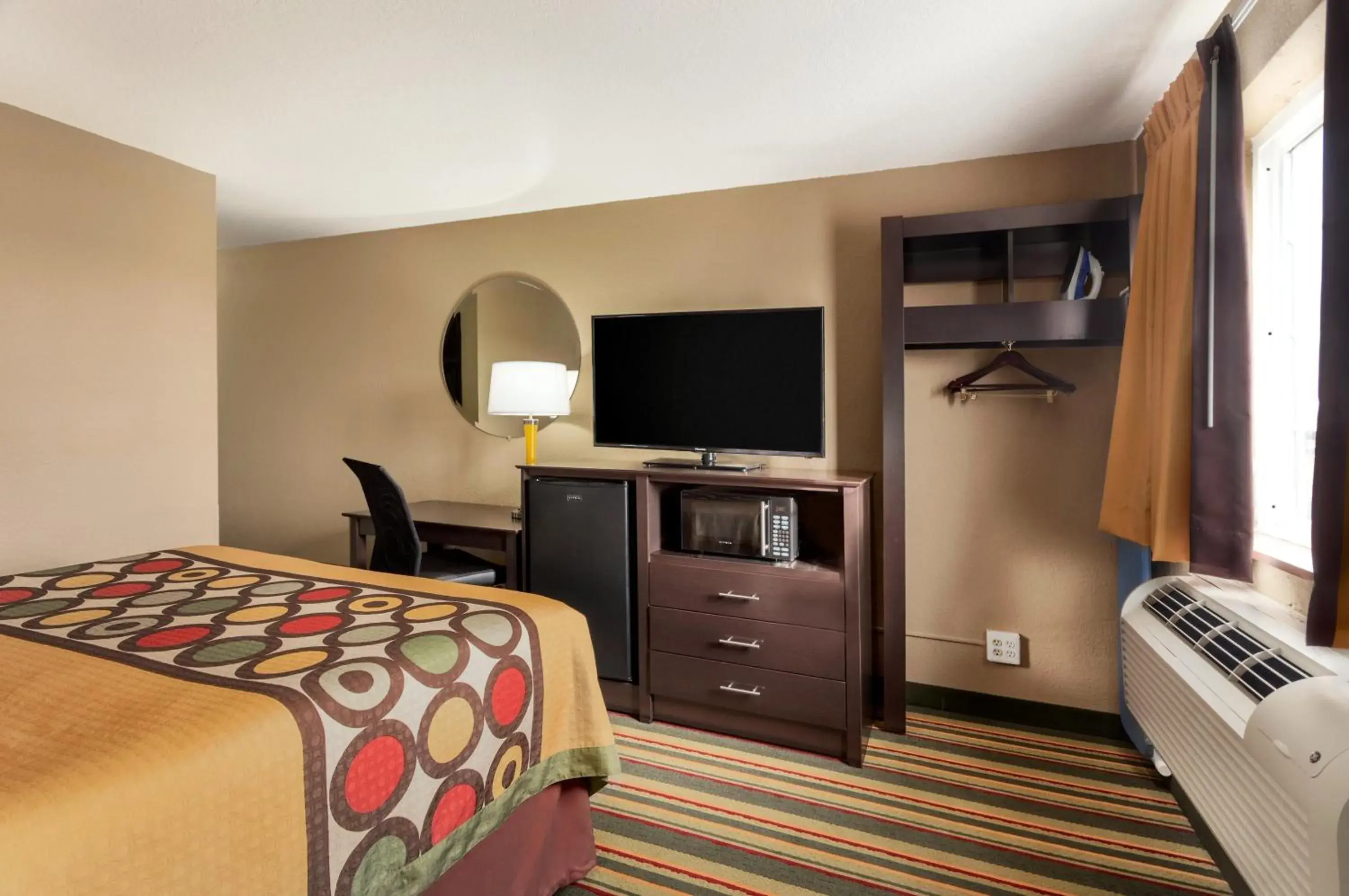 Bedroom, TV/Entertainment Center in Super 8 by Wyndham Joplin