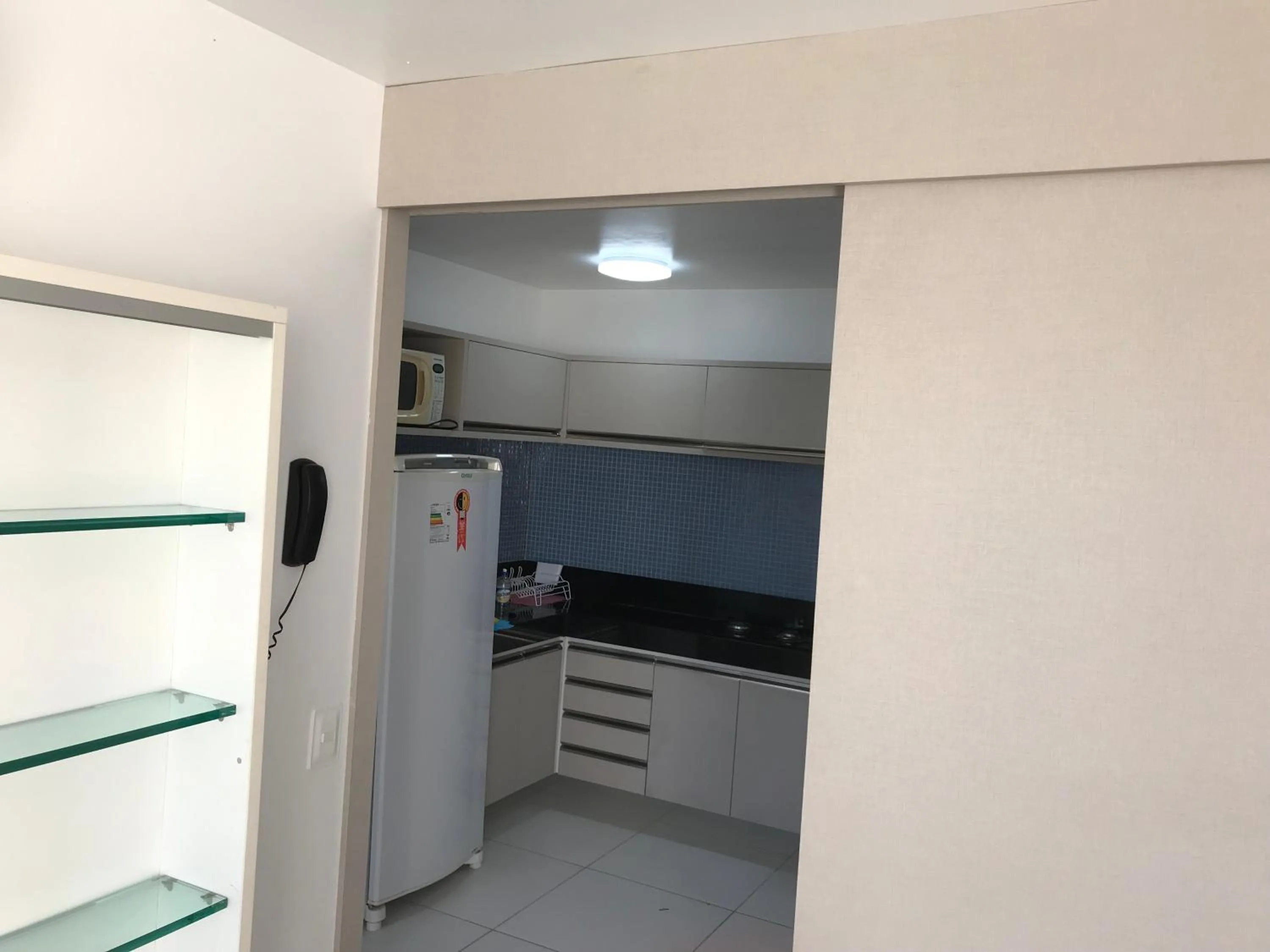 Kitchen or kitchenette in Marupiara Suites Flats