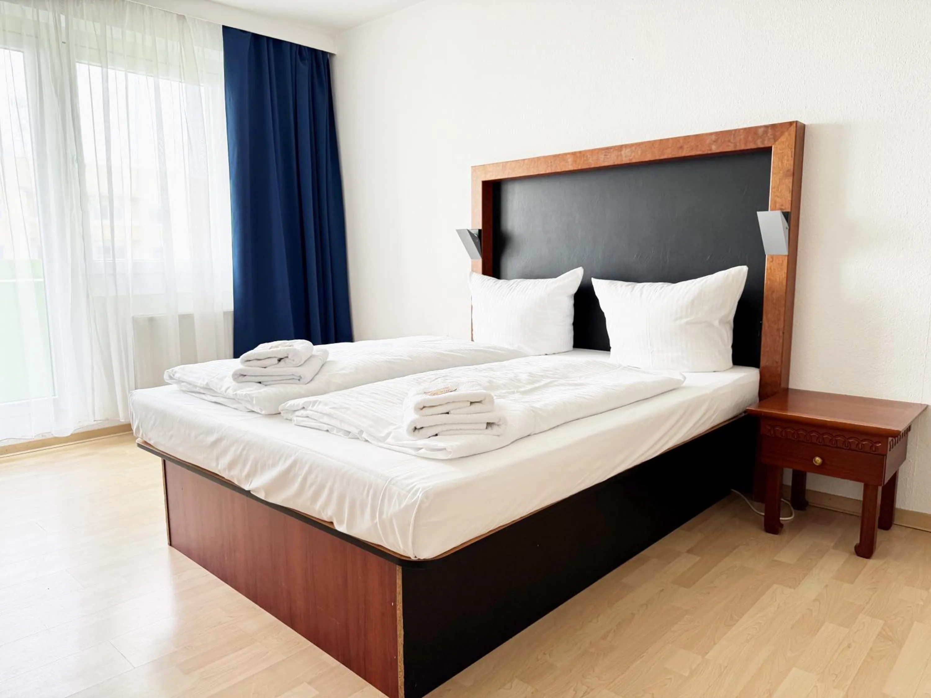 Bed in Alpha Apparthotel leipzig-Rötha