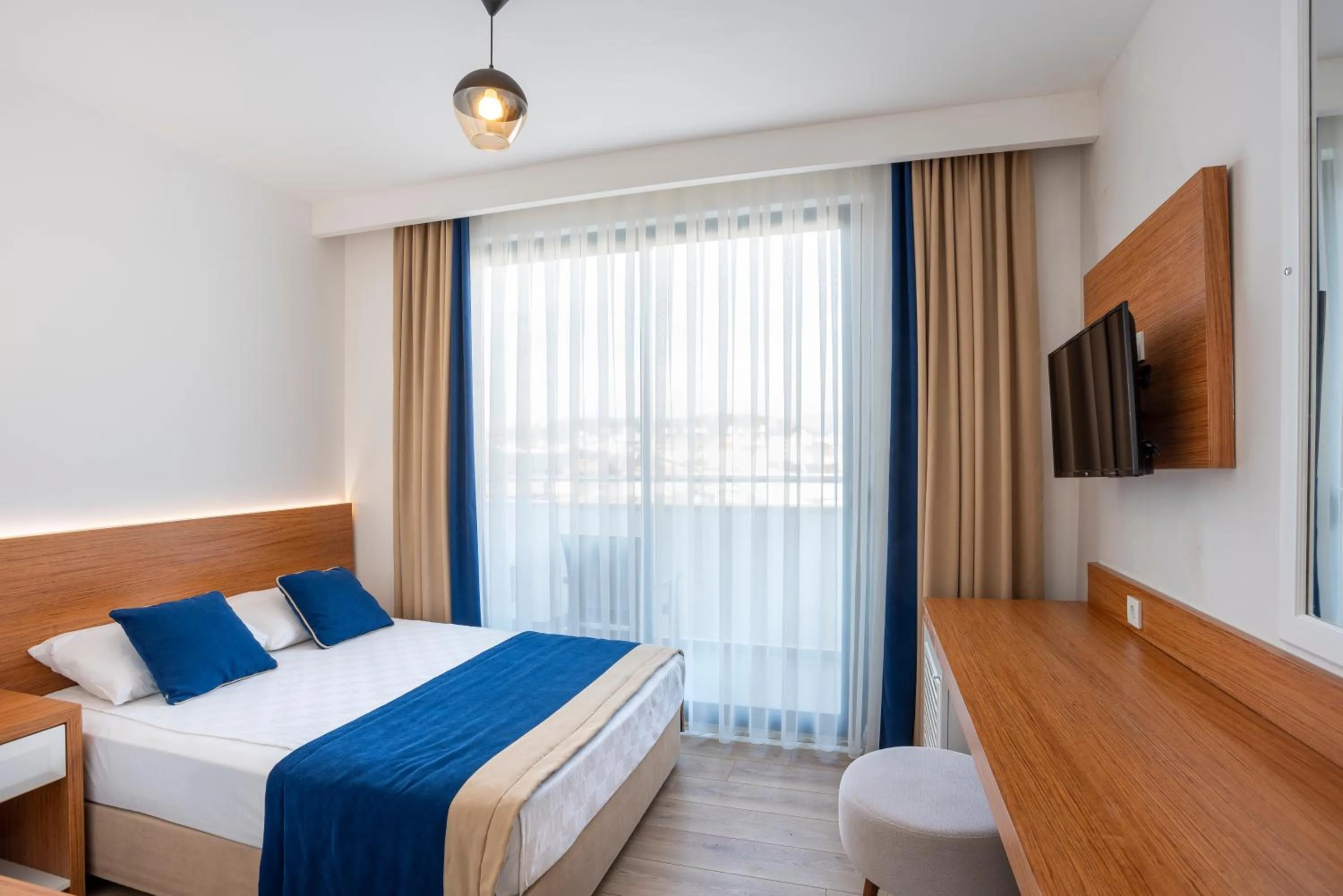 Bed in The Sansa Hotel & Spa