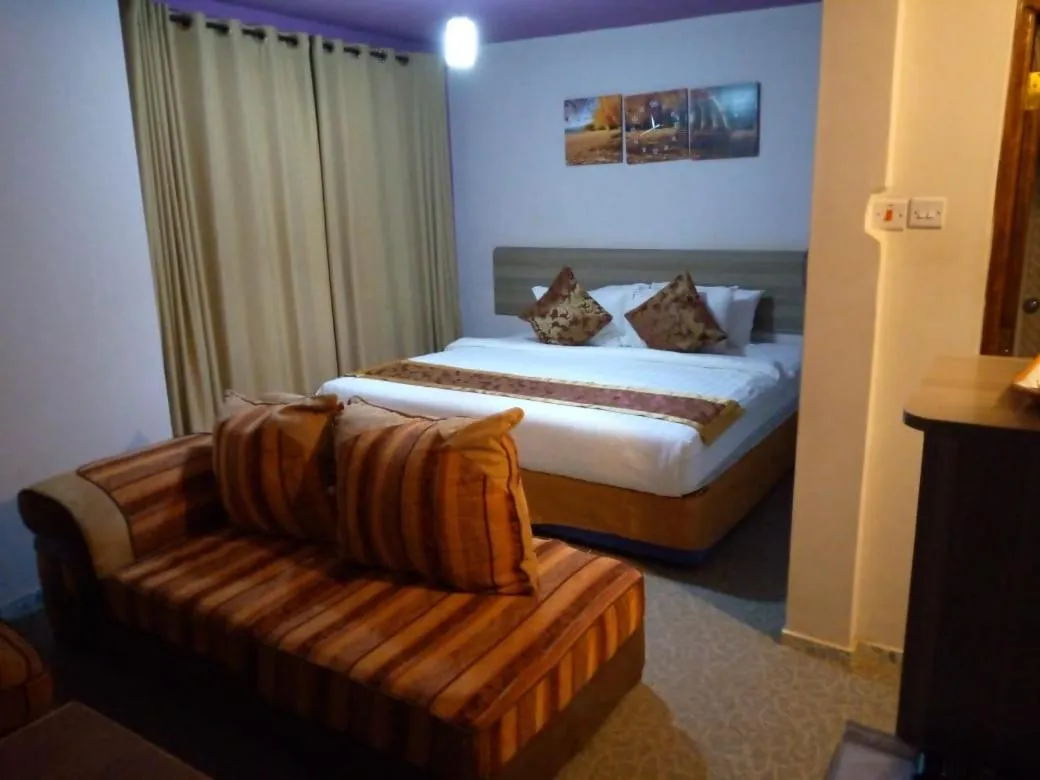 Bed in Maple Inn Hotel