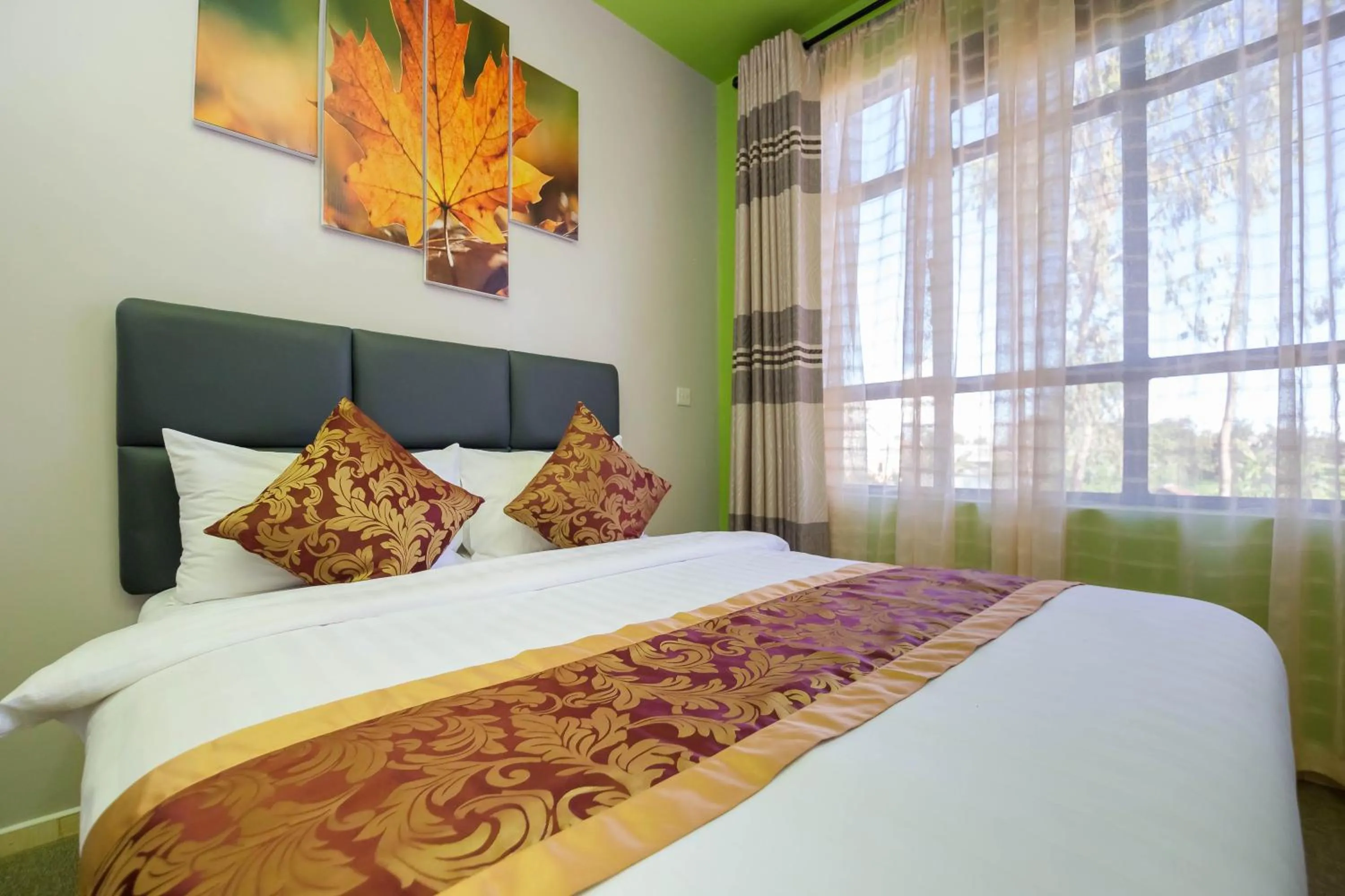 Bed in Maple Inn Hotel