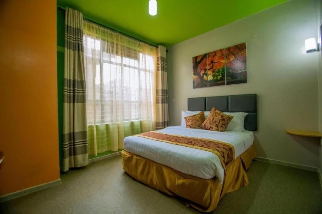 Bed in Maple Inn Hotel