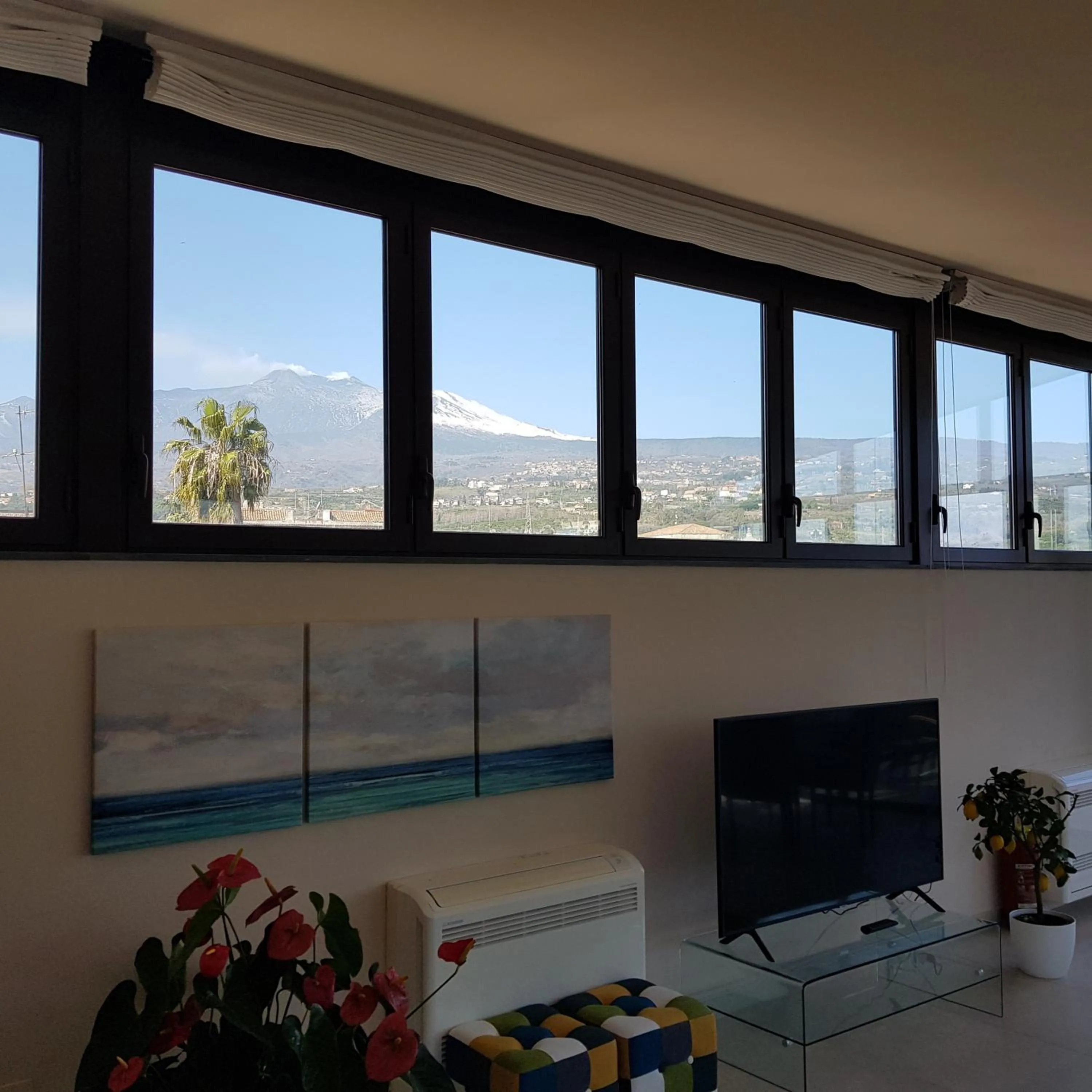 Communal lounge/ TV room in Luxury Panoramic Loft with heated pool near Catania, Taormina, the Sea and Mount Etna by SicilianRelaxingHomes