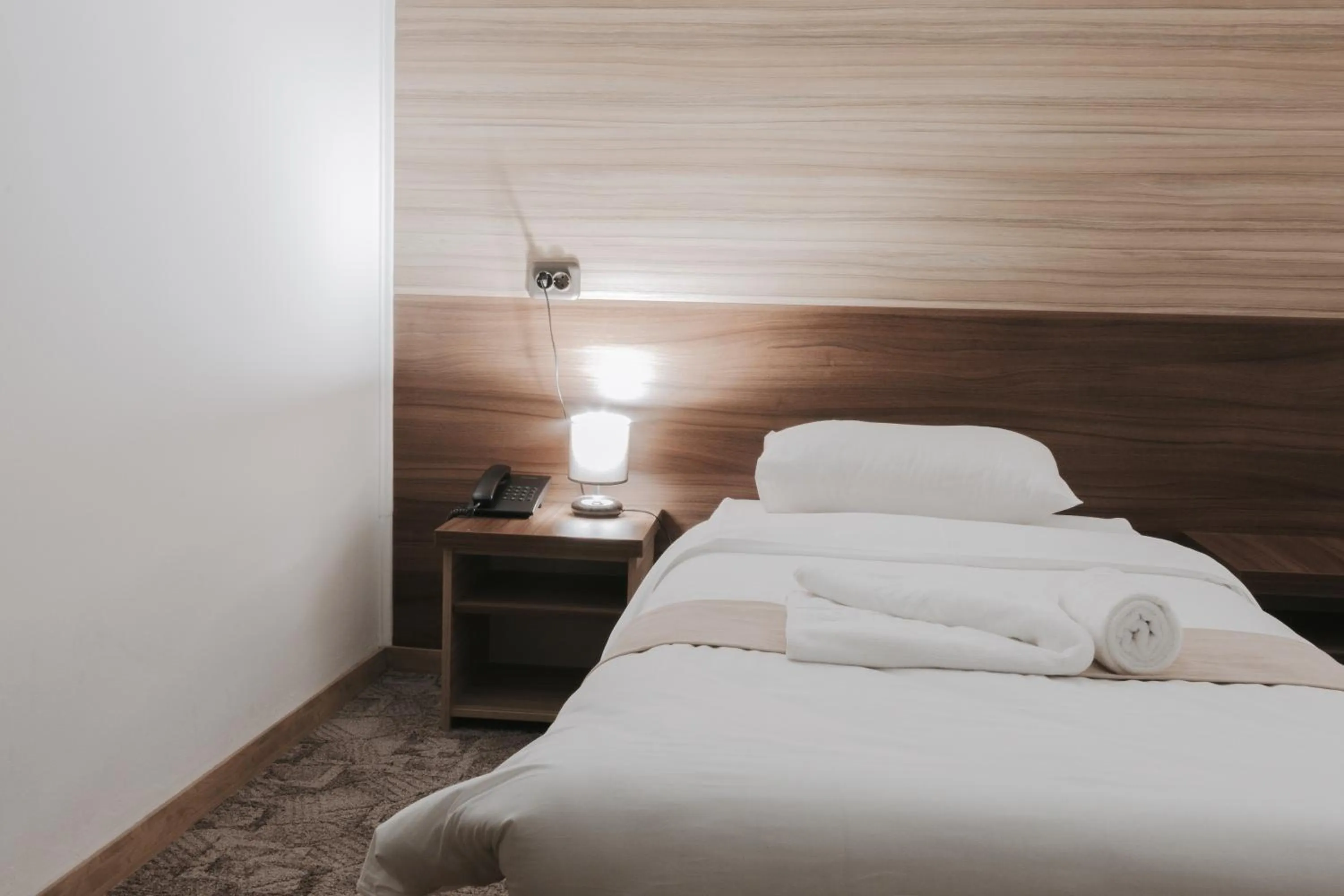 Bed in Hotel Apollo Central