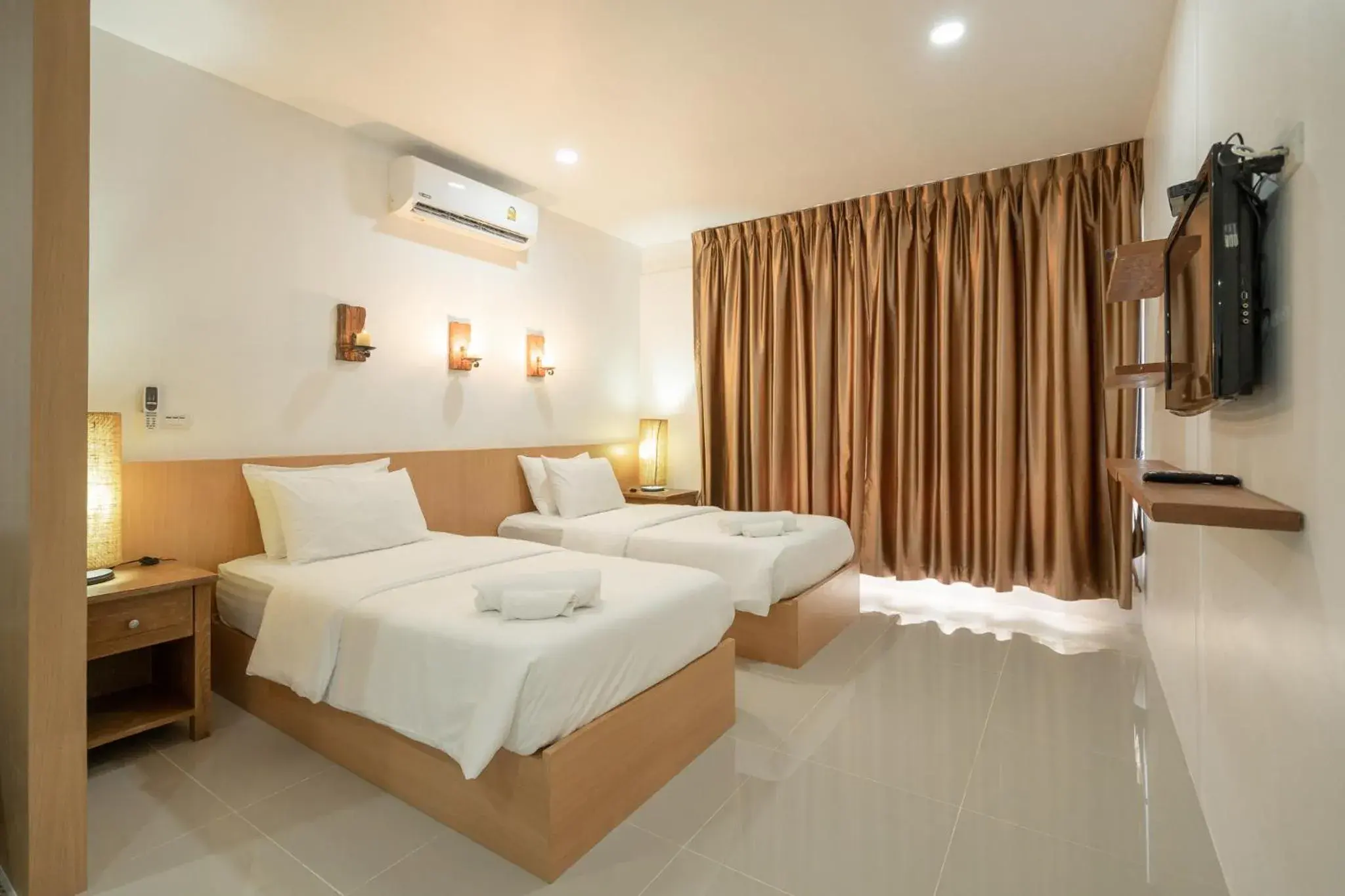 Bed in The Loft Panwa Resort Bed in The Loft Panwa Resort