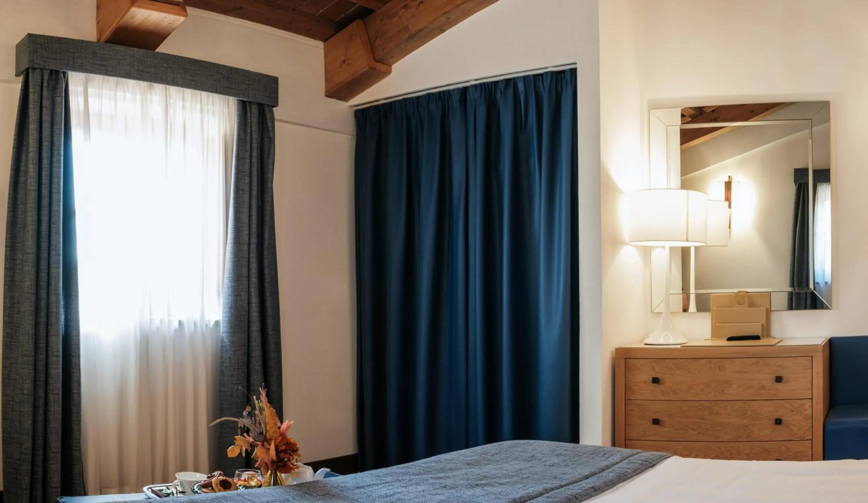 Bed in Villa Tolomei Hotel & Resort