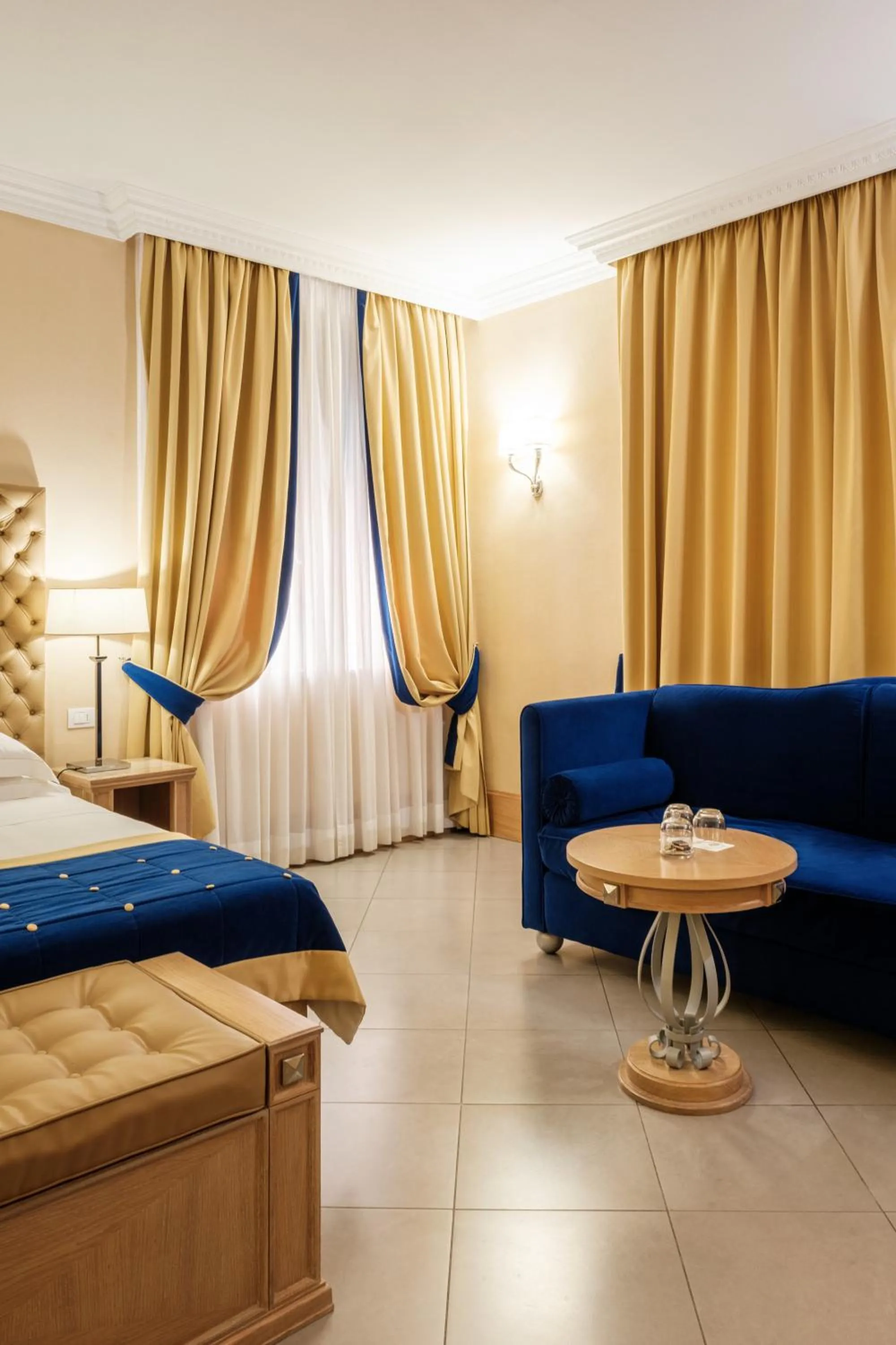 Bed in Villa Tolomei Hotel & Resort