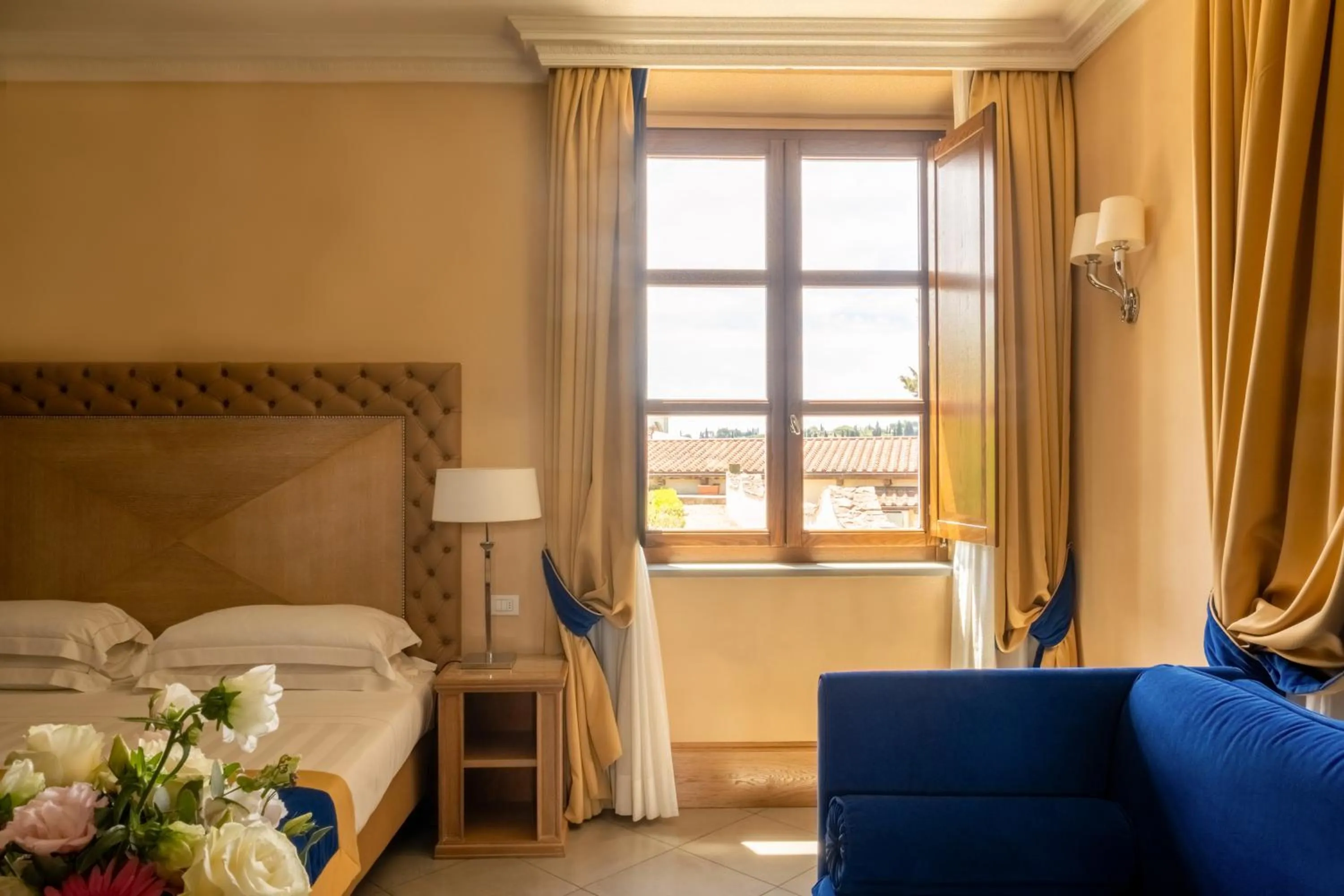 Bed in Villa Tolomei Hotel & Resort