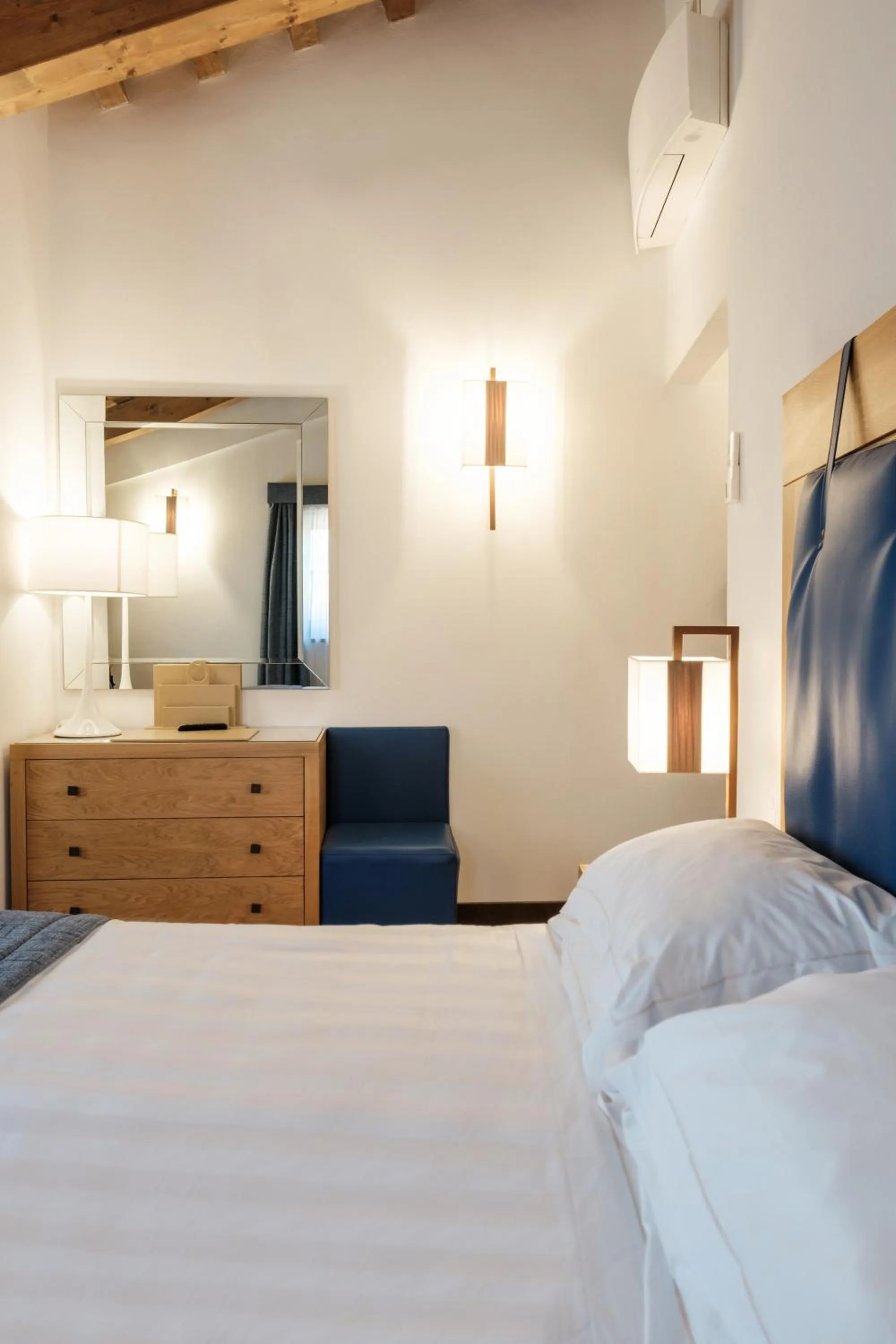 Bed in Villa Tolomei Hotel & Resort