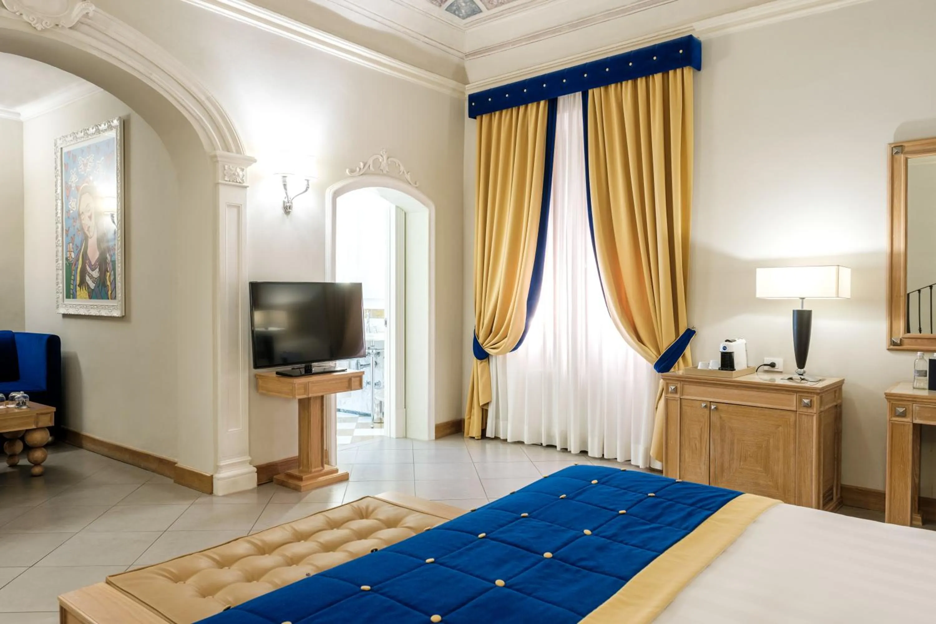 Bed in Villa Tolomei Hotel & Resort